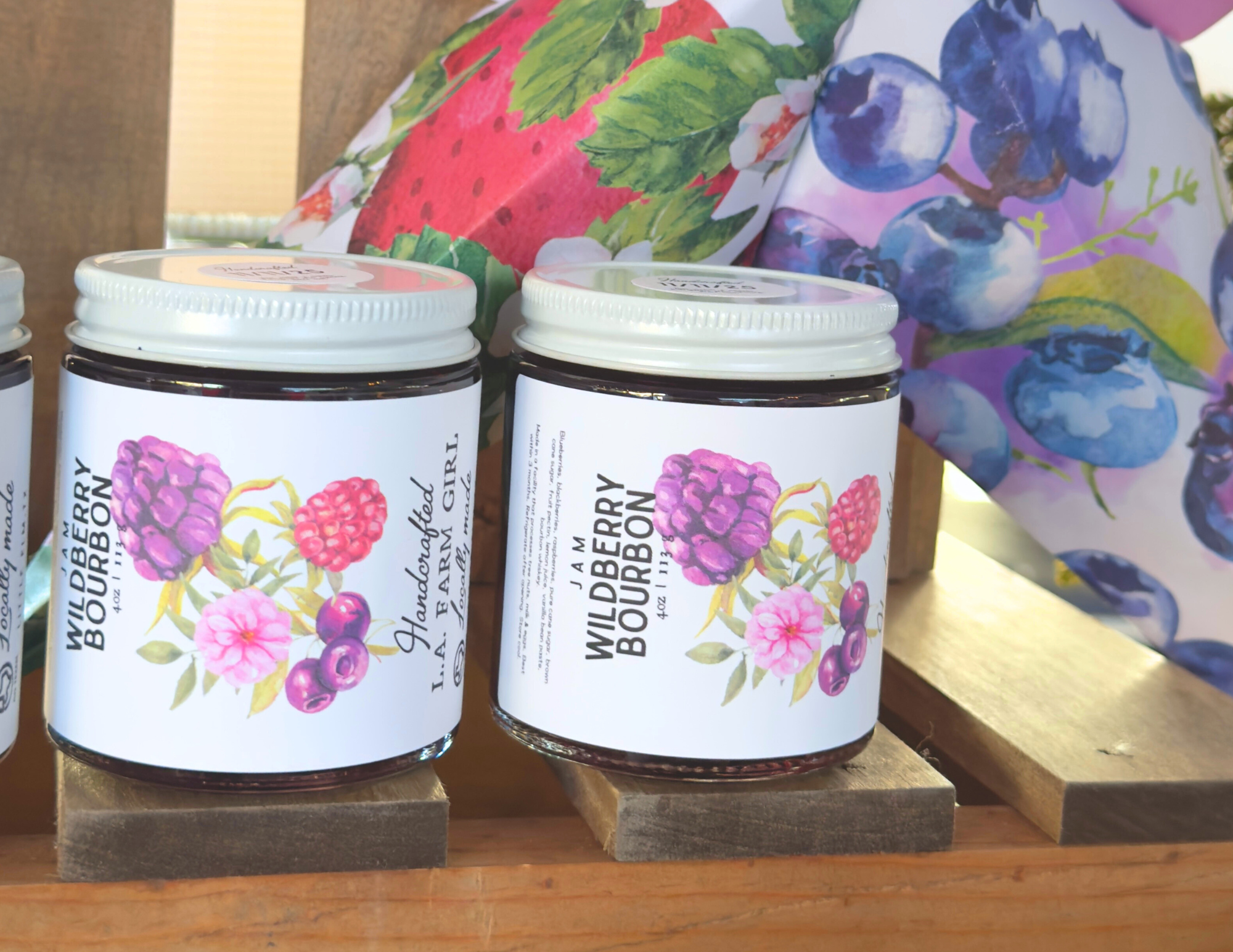 Wildberry Bourbon and Blueberry Merlot small-batch Texas jam jars side by side.