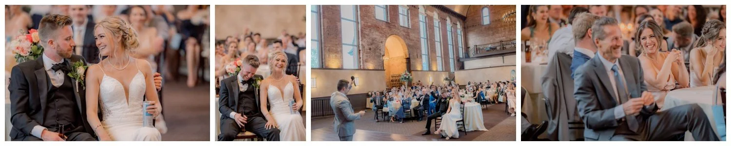Bride and groom smiling as they listen to toasts at their wedding reception.