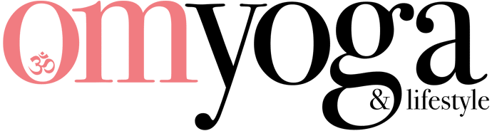 Close-up of the word 'Om' in pink, with the 'O' containing a small Om symbol on a black background.