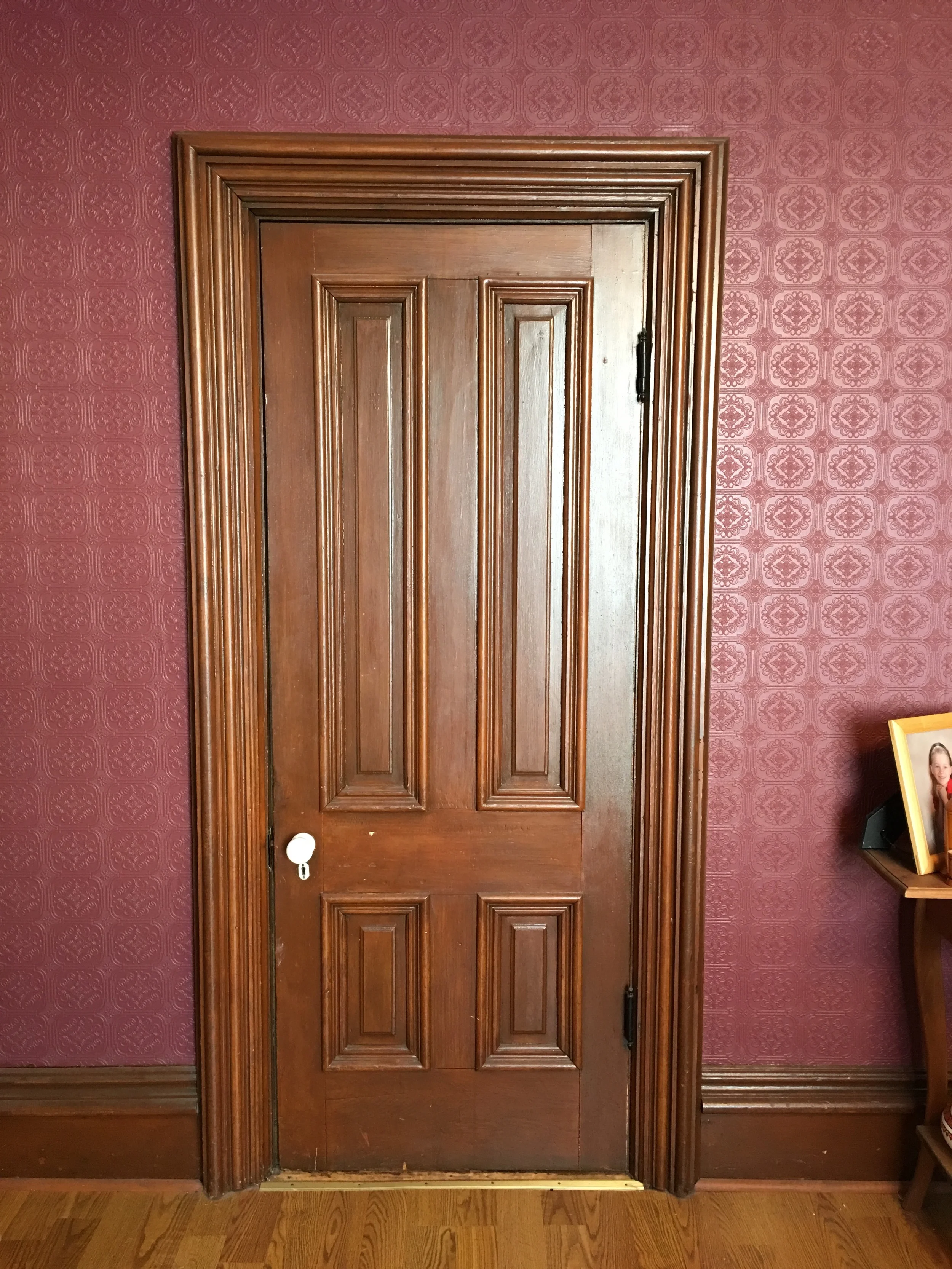 ...While this door, in the dining room, shows what the woodwork looks like in the front of the house. Well, in most of the front of the house...