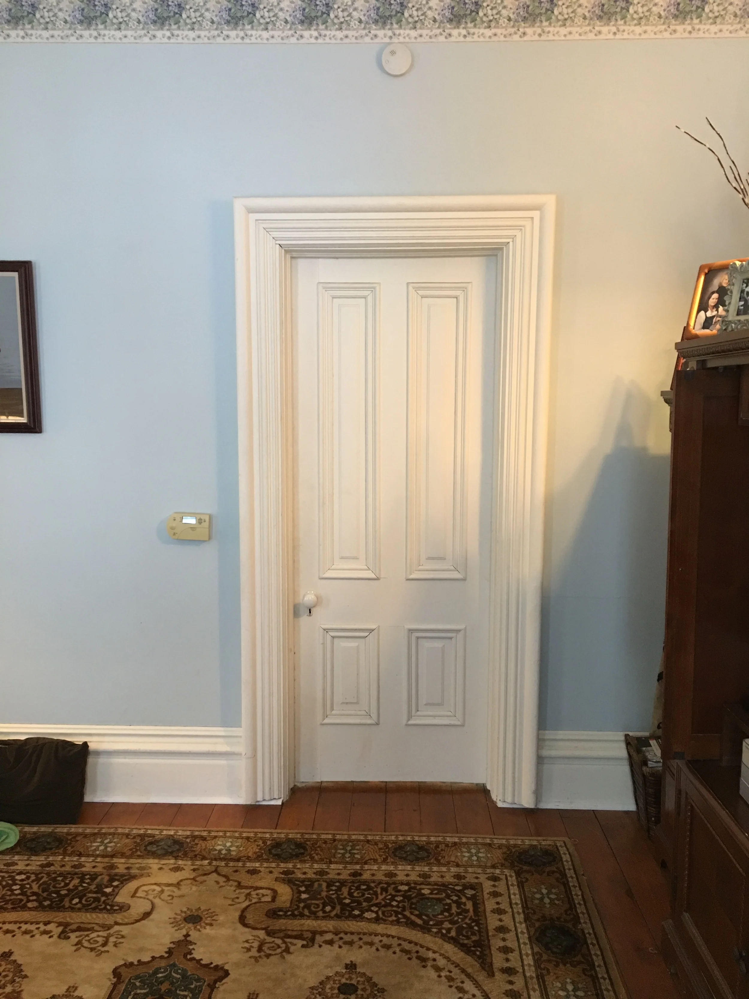 This is a door in the living room - note the way the surround builds out all the way to the outside edge...