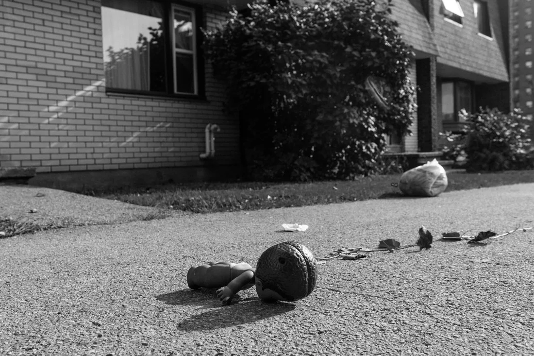 The work explores the stages of grief, mistrust, and defeat experienced by the evicted residents, as they find themselves alienated from the new vision of the neighbourhood. By shinning the spotlight on the misguiding normalcy of eviction, the photographs provide a visual platform for the uprooted, as they are eclipsed by gentrification.