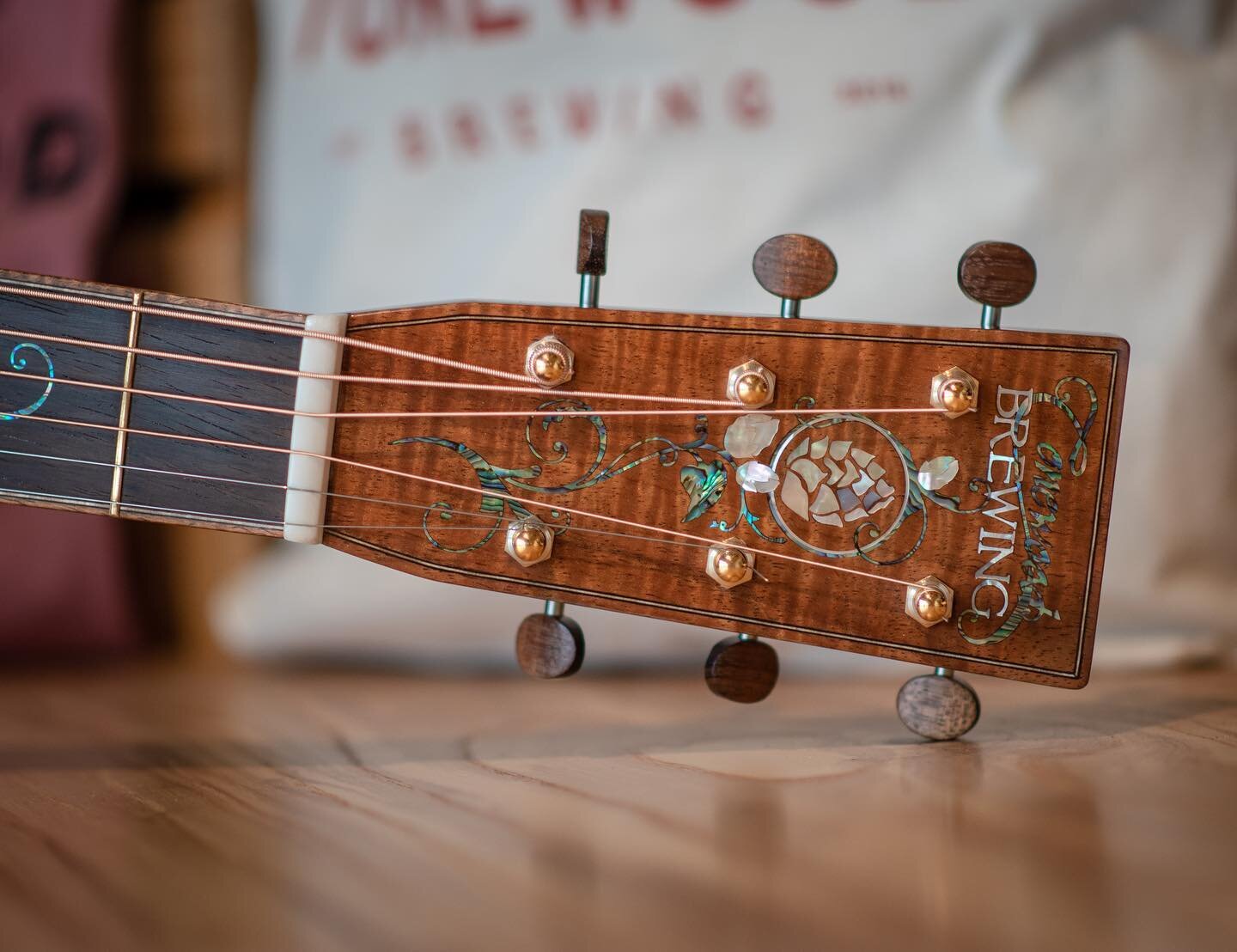 The @tonewoodbrewing D-42&rsquo;s headstock. On display at @artisanguitarshow April 14-16 in Harrisburg, PA. #luthier #luthiery #luthiermade #craftbeer #brewing #koa #oakbarrel #acousticguitar #tonewood