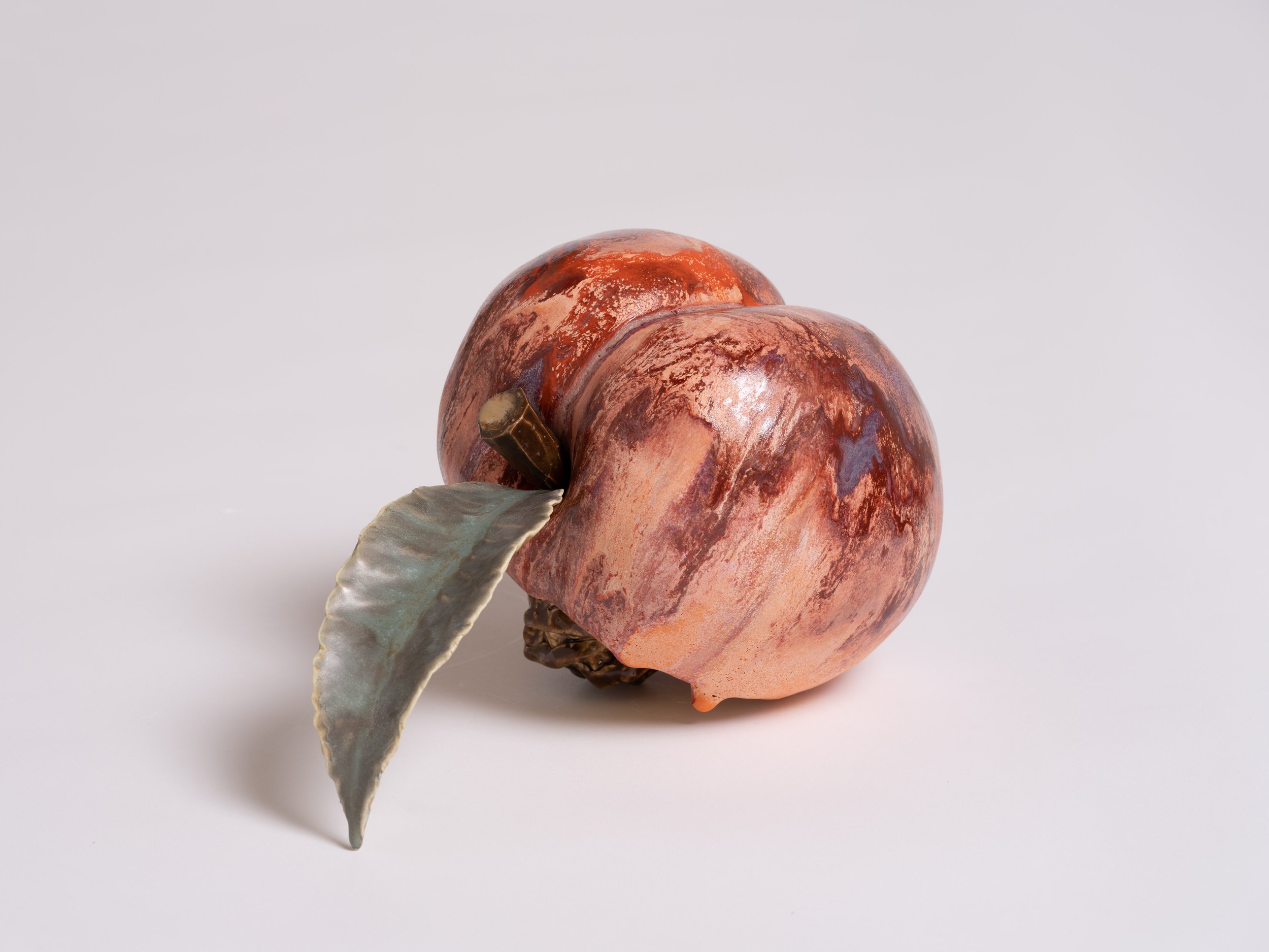   Peach with Pit II , 2022  Glazed porcelain  12 1/2 x 7 x 7 inches (31.8 x 17.8 x 10.2 cm)&nbsp; 