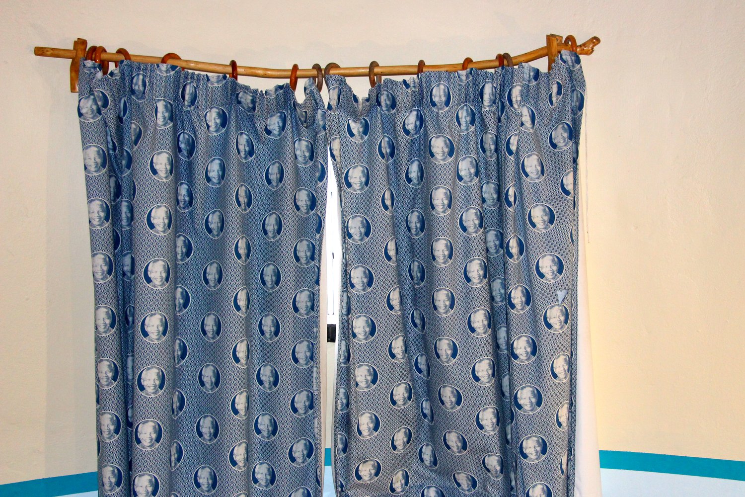 Nelson Mandela curtains are an obvious must for any modern hut!