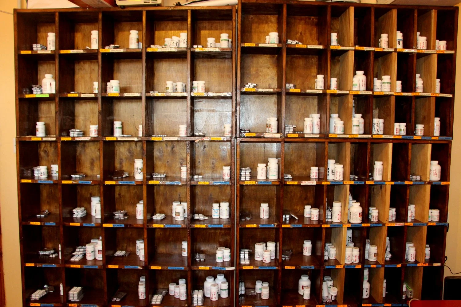 Each child has a cubby for their medication. The dosage depends on their stage of HIV.