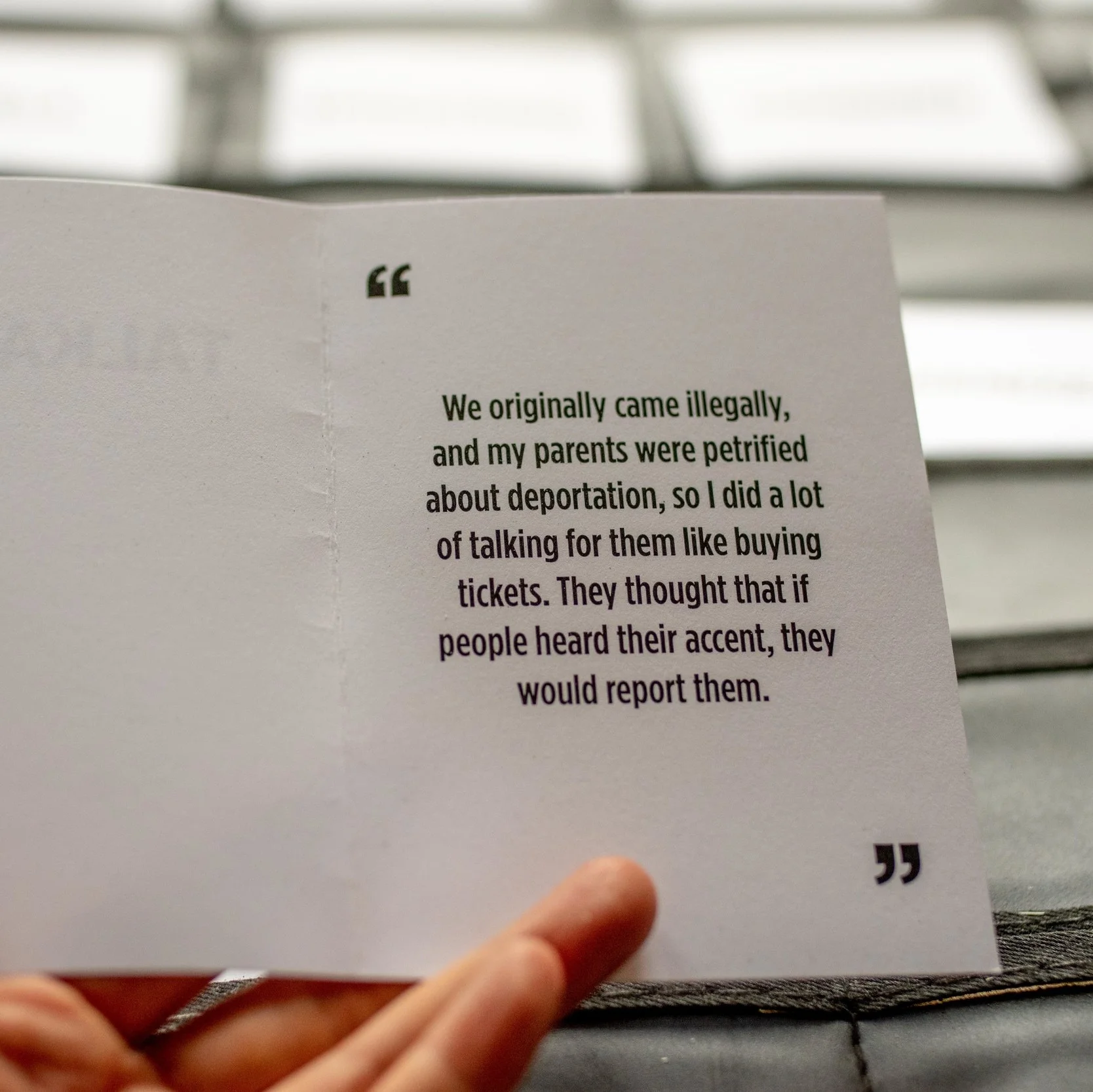 The cards contained quotes from other immigrants of color about their experience in the country