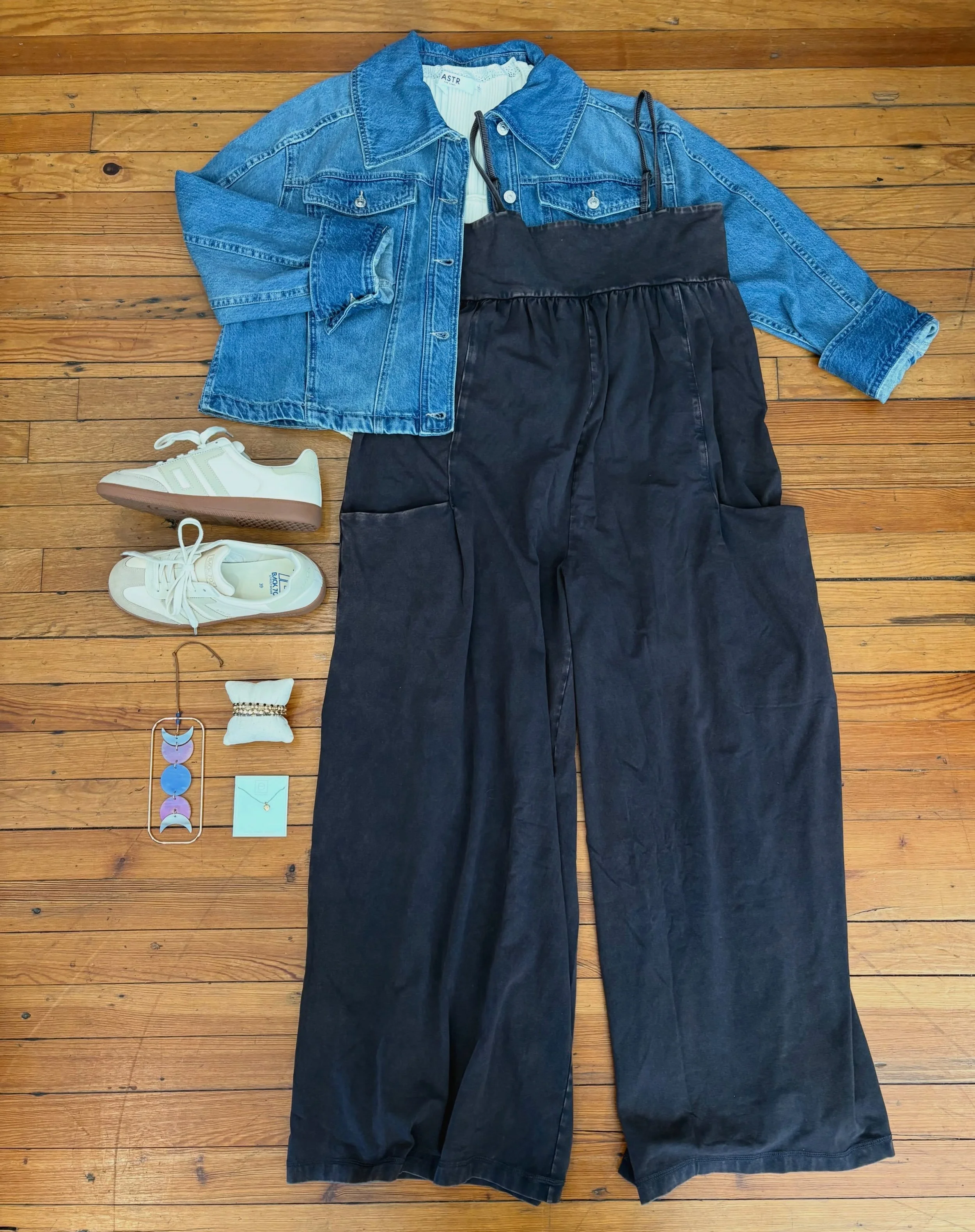This jumpsuit is always a best seller- and for good reason!
