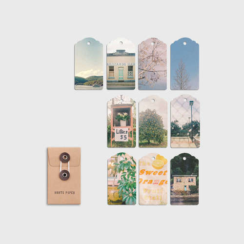 Ten swing tags, each featuring a different photograph originally captured on 35mm analogue film.