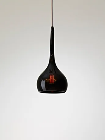 Bobo Pendent - $955.00 Curvaceous yet elegant, this luscious little luminere will offer warmth and intrigue in any social setting. These exquisite hand blown glass forms are beautifully imperfect and each unique. Adorning a bare incandescent light source, Bobo’s black glass tint adds a little attitude to functionality. Available with varied cloth cord, and the option of a black or white ceiling plate.