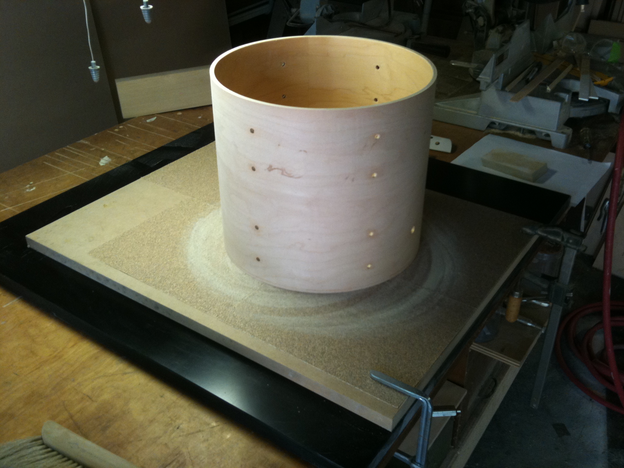 Cleaning up the cut with a DIY sanding table. 