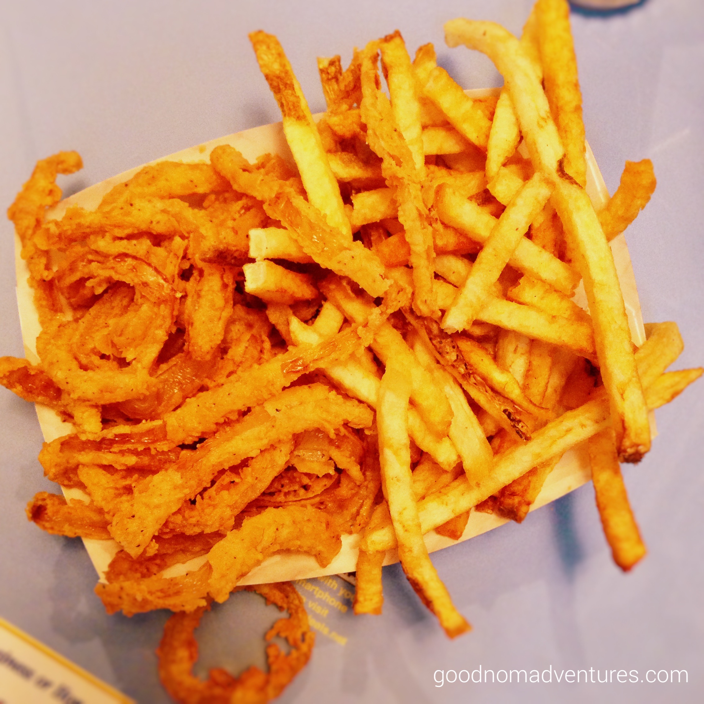 Half and half of fries and onion rings