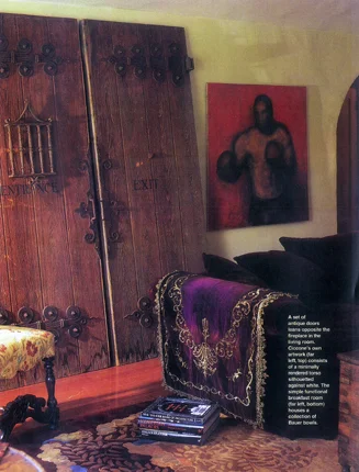 Interior detail with a folding screen, carved chair and artwork