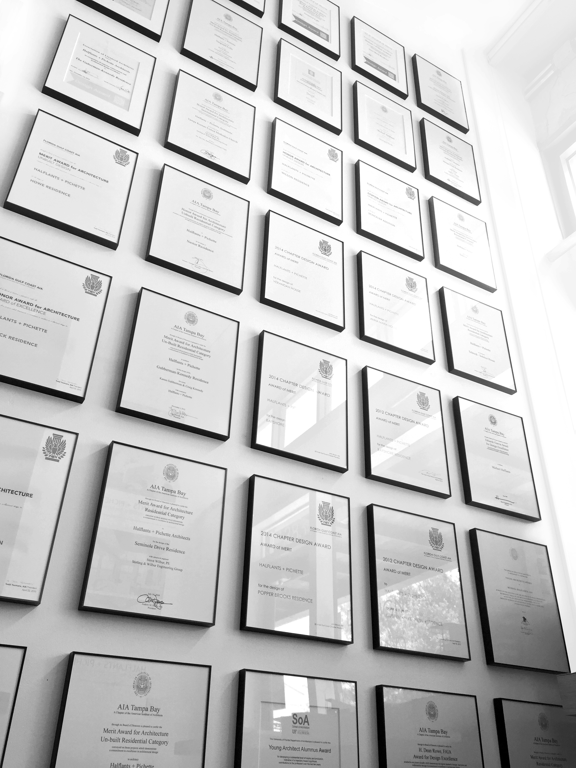 Since 2010, Halflants + Pichette has been recognized with more American Institute of Architects design awards than any other firm in Florida's Gulf Coast. Shown are the ones displayed in the Sarasota office.