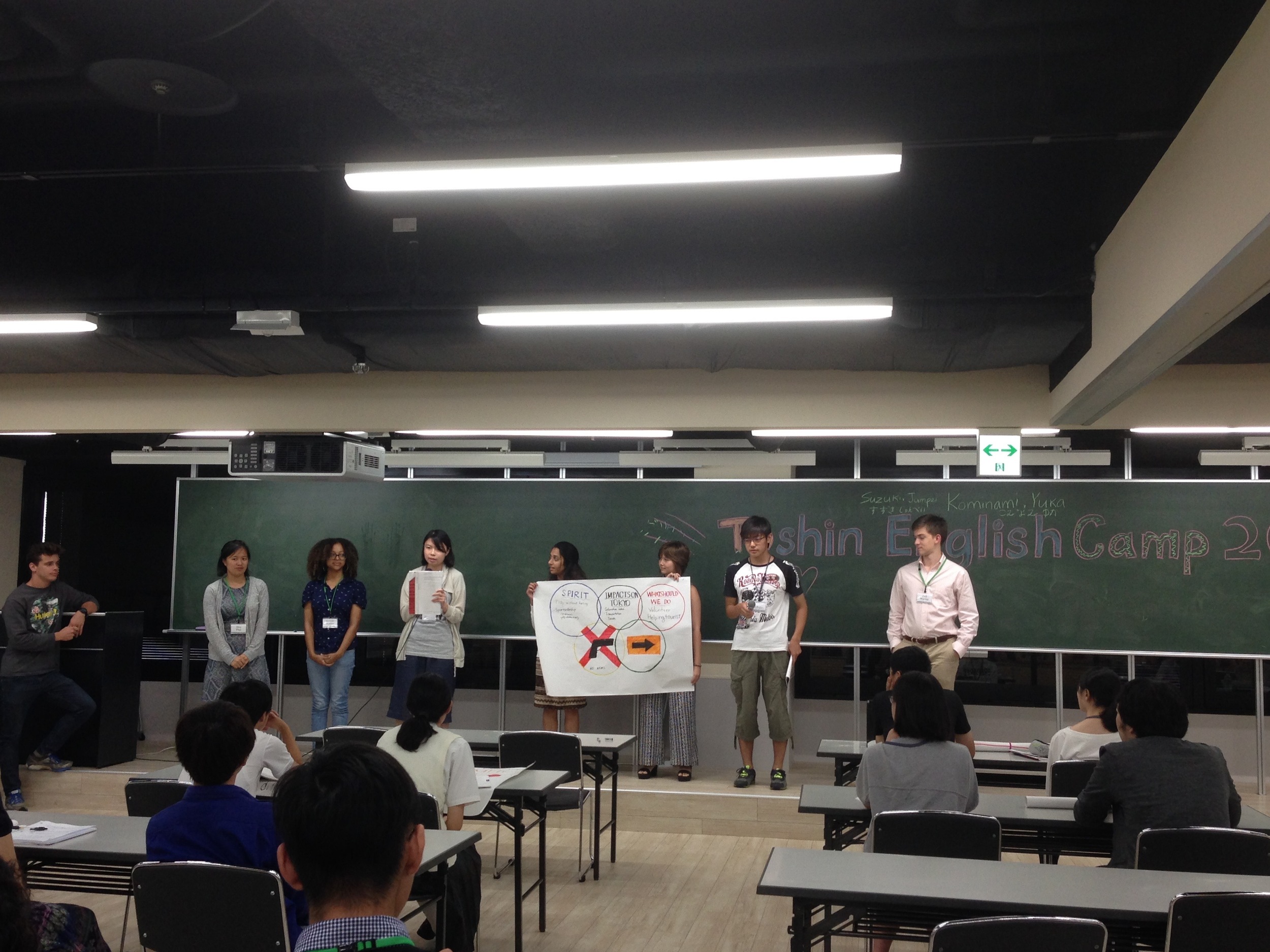 Japanese students present alongside their intern mentors. 