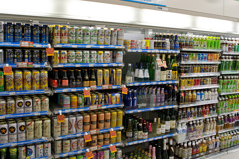 If I included a picture of one of the awesome snack shelves, I had to include a picture of the glorious drink-wall. This is a pretty common sight in any konbini . Alcohol's nestled right up next to the soft drinks. You can usually find all 4 of the main Japanese beer brands (Sapporo, Asahi, Kirin and Suntory) as well as a million different kinds of sake , tea, soda pop, coffee, sports drinks, etc.