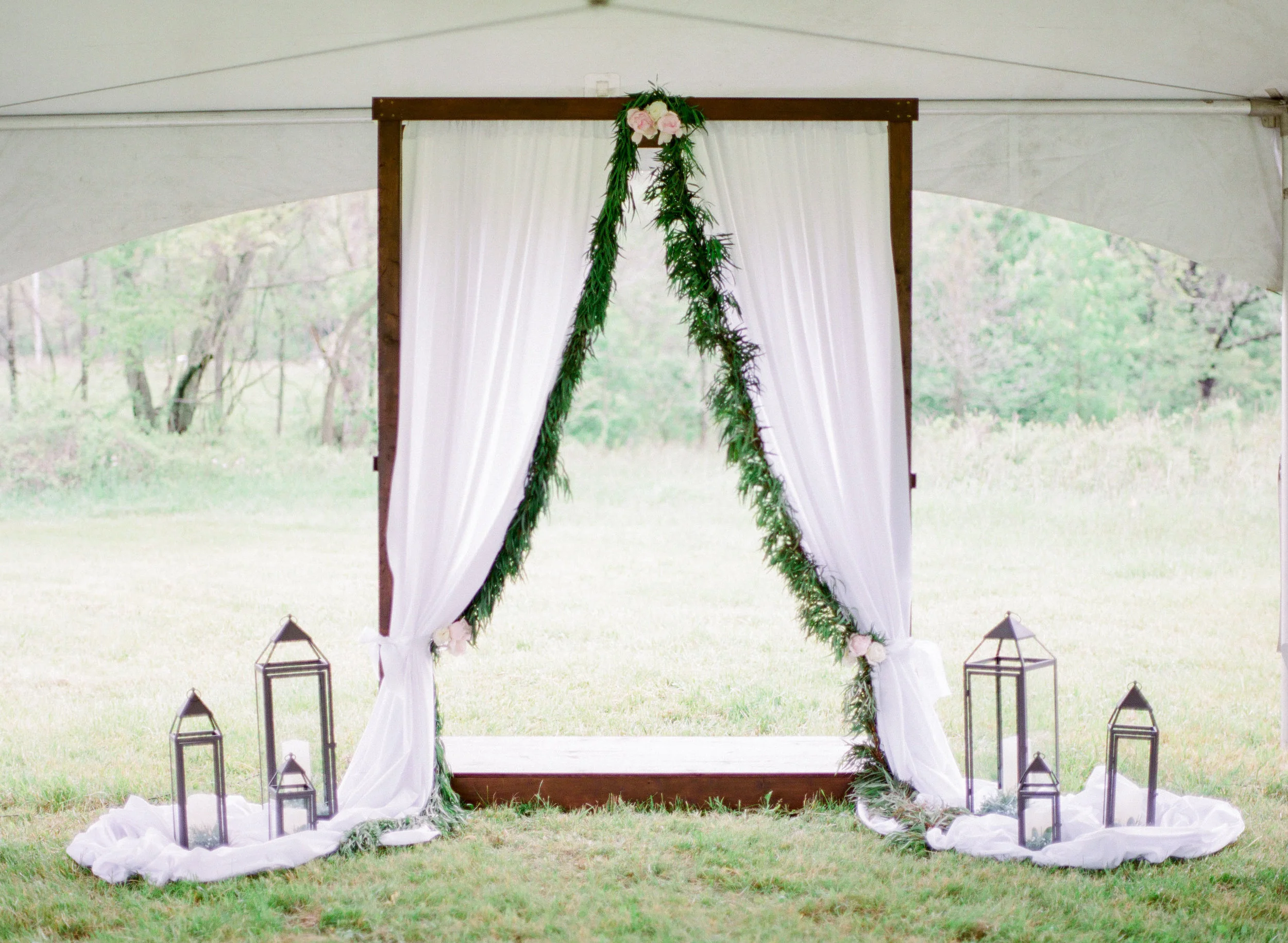 You can also set up a tent in the field to provide another covered area for a wedding ceremony. Photo: The Jacksons Photography