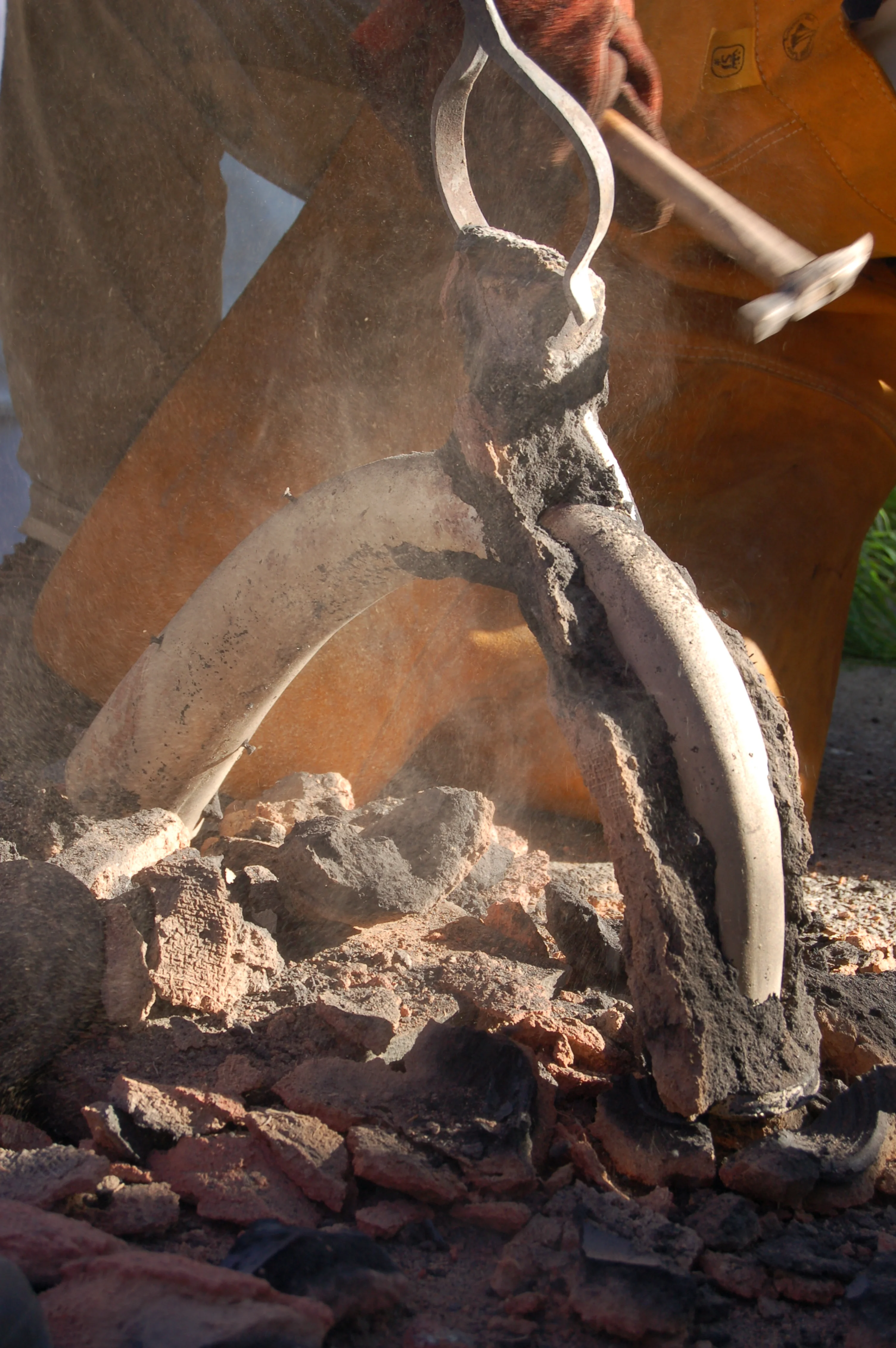 A replica of the LBA Dunmanway horn is broken out of the mould. Pouring cup and mould thickness are clearly visible.