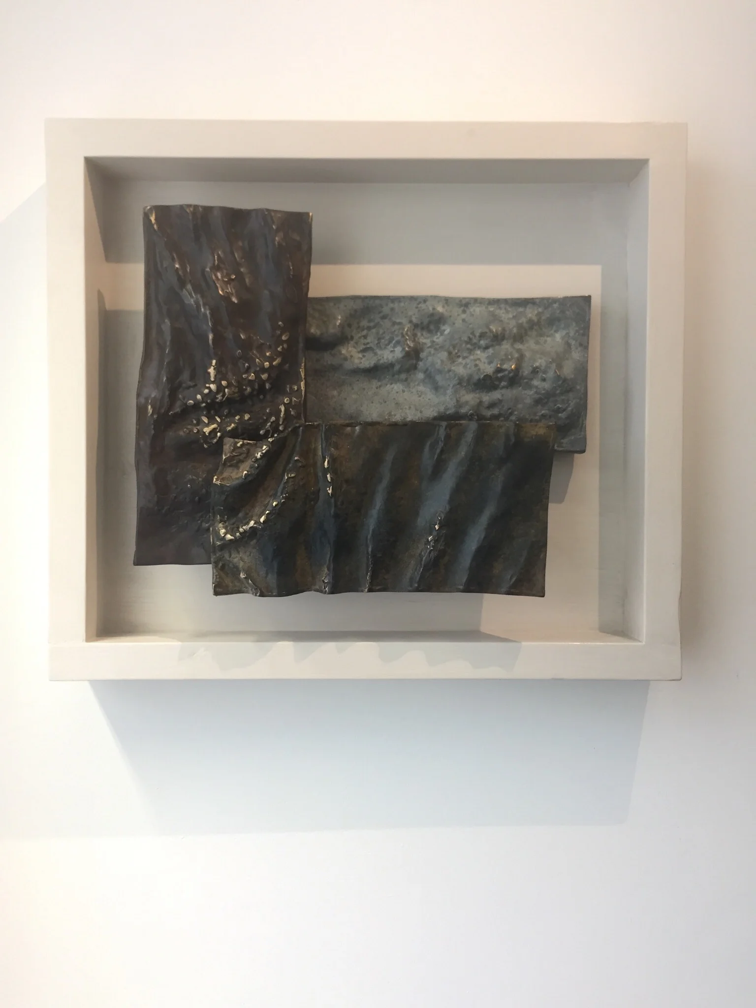 Sea, River, Sky; bronze. A wall-mounted, three-part relief composition based on the natural water cycle.