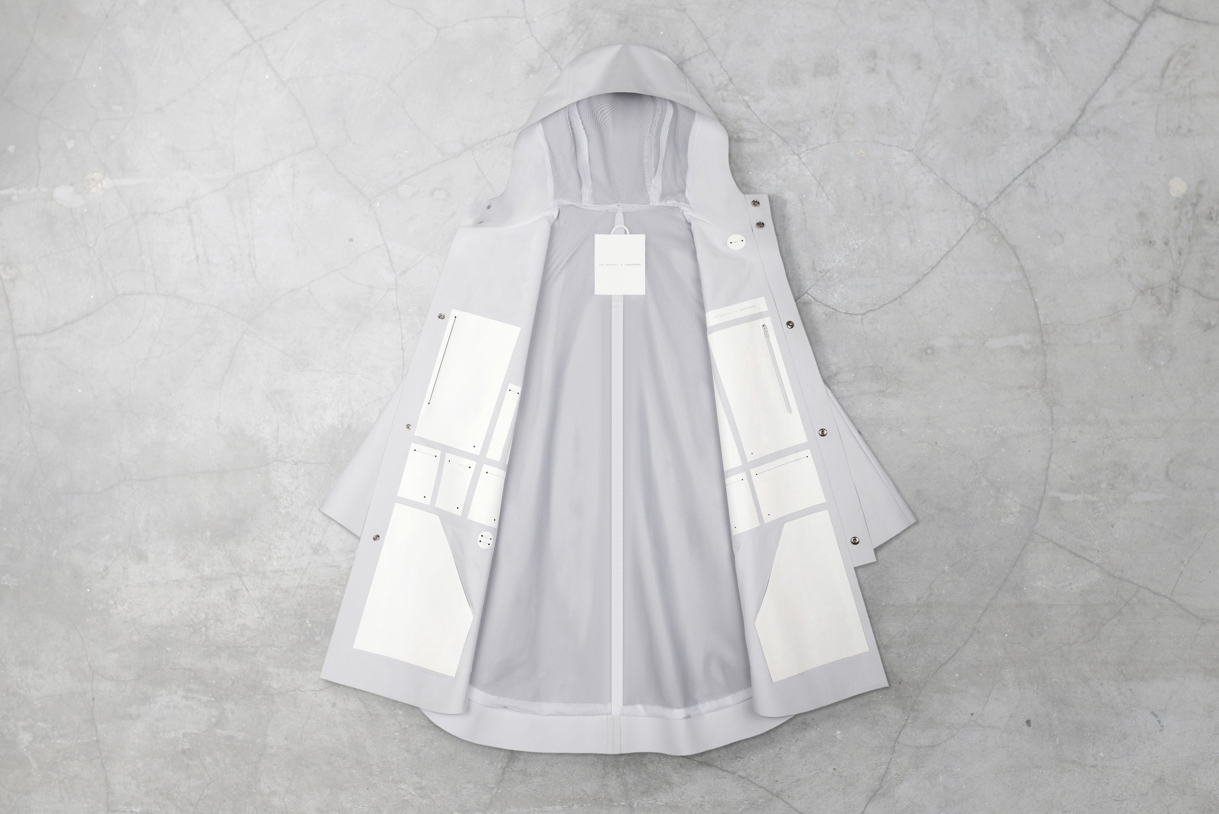 The heat-sealed and lasercut poncho was developed and produced in NYC using the country's most innovative factory, utilizing heat-seal tapes, films and raw-edging.