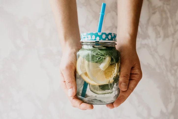 Homemade citrus lemonade or juice or mojito in a jar.