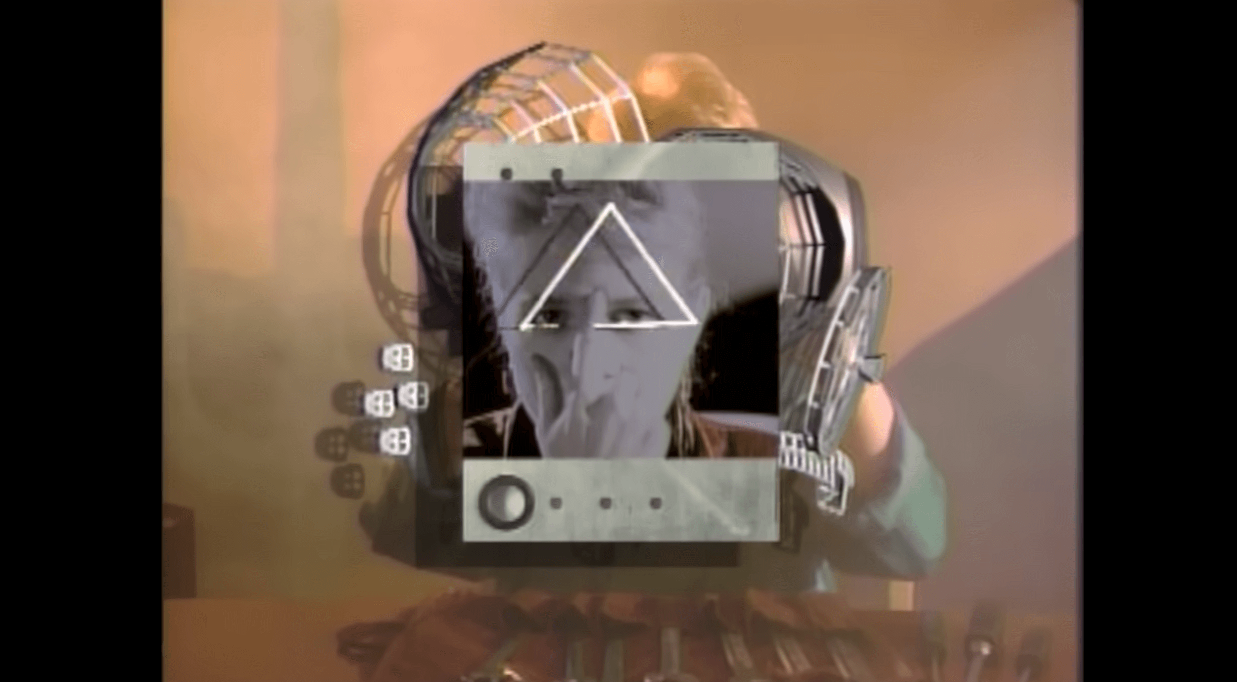 Creenshot of Valerie in the video holding her pointer finger between her eyes with a triangle superimposed over her forehead..