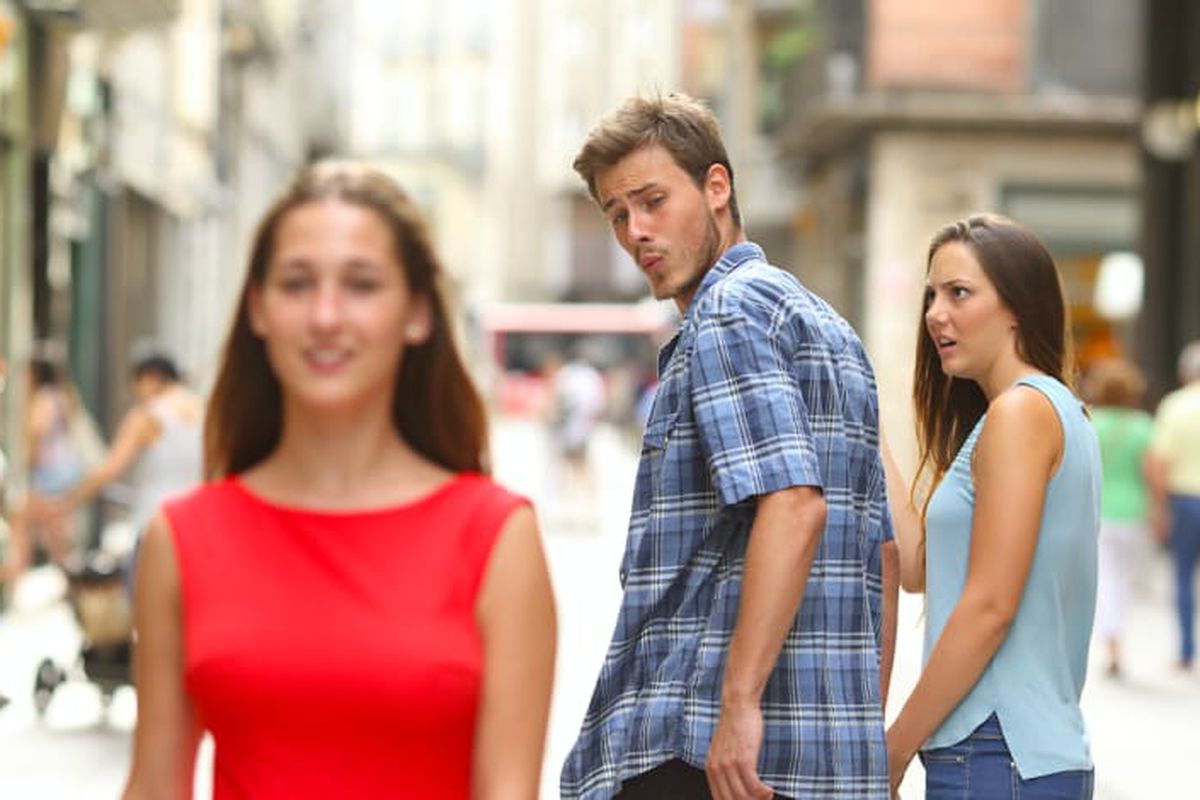 Manlookingatothergirl.jpeg