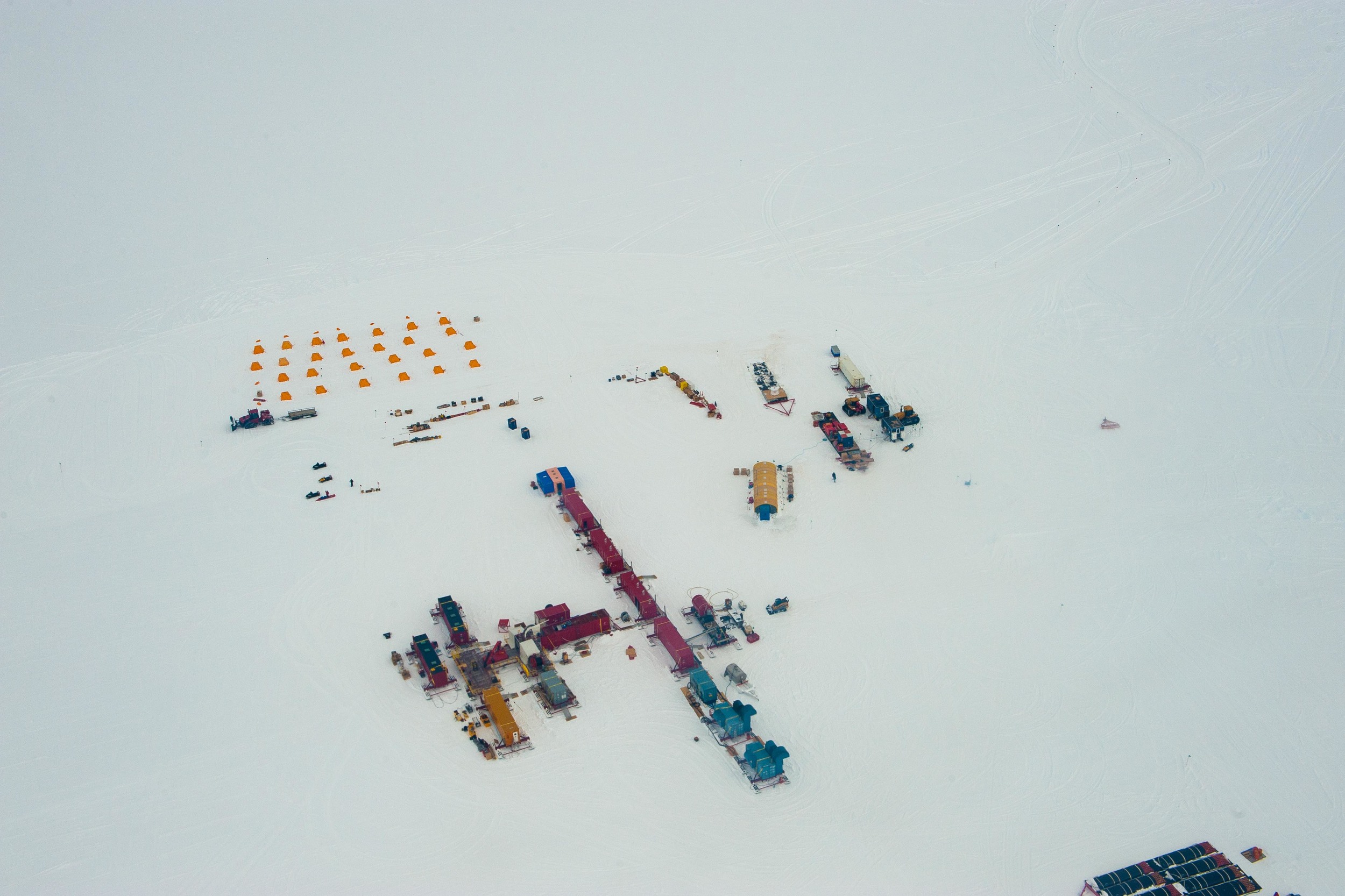  The camp at Subglacial Lake Whillans, with yellow tents for sleeping and red shipping containers for the drill and labs. PHOTO BY J.T. THOMAS 