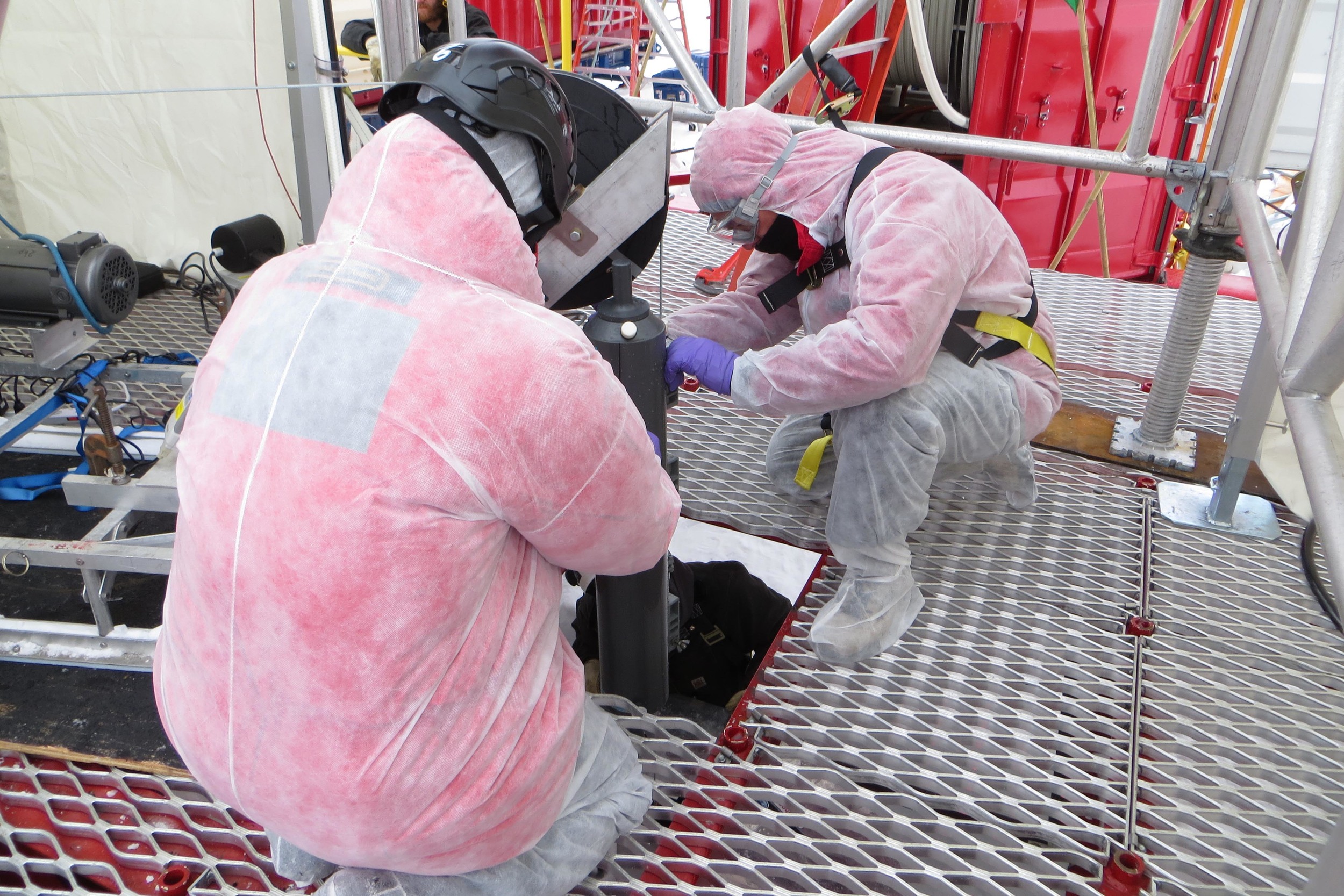 John Priscu of Montana State University and Brent Christner of Louisiana State University deploy the sampling bottle down the borehole. PHOTO COURTESY TRISTA VICK-MAJORS