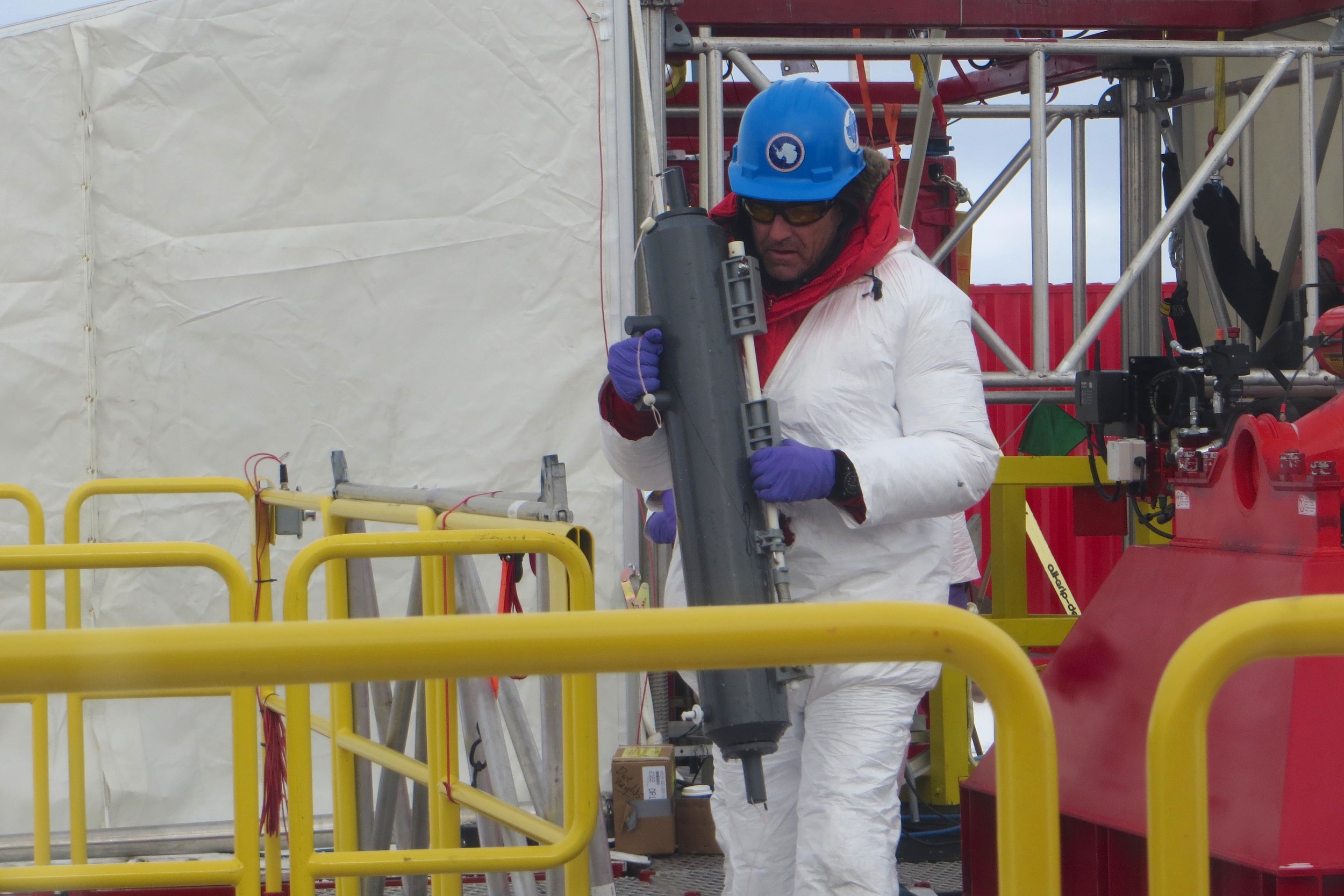  Montana State University professor John Priscu carries the first sample from the drill platform to the lab. PHOTO BY TRISTA VICK-MAJORS 