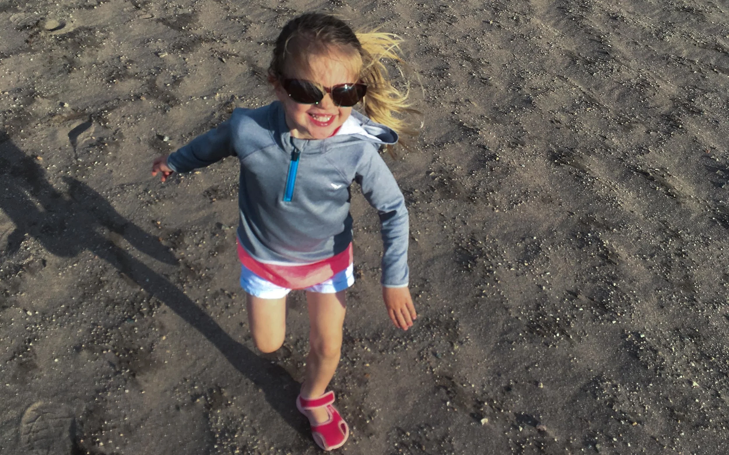 The infectious glee of a toddler (Maggie Guseman) in the sun (Photo by Emily Guseman)