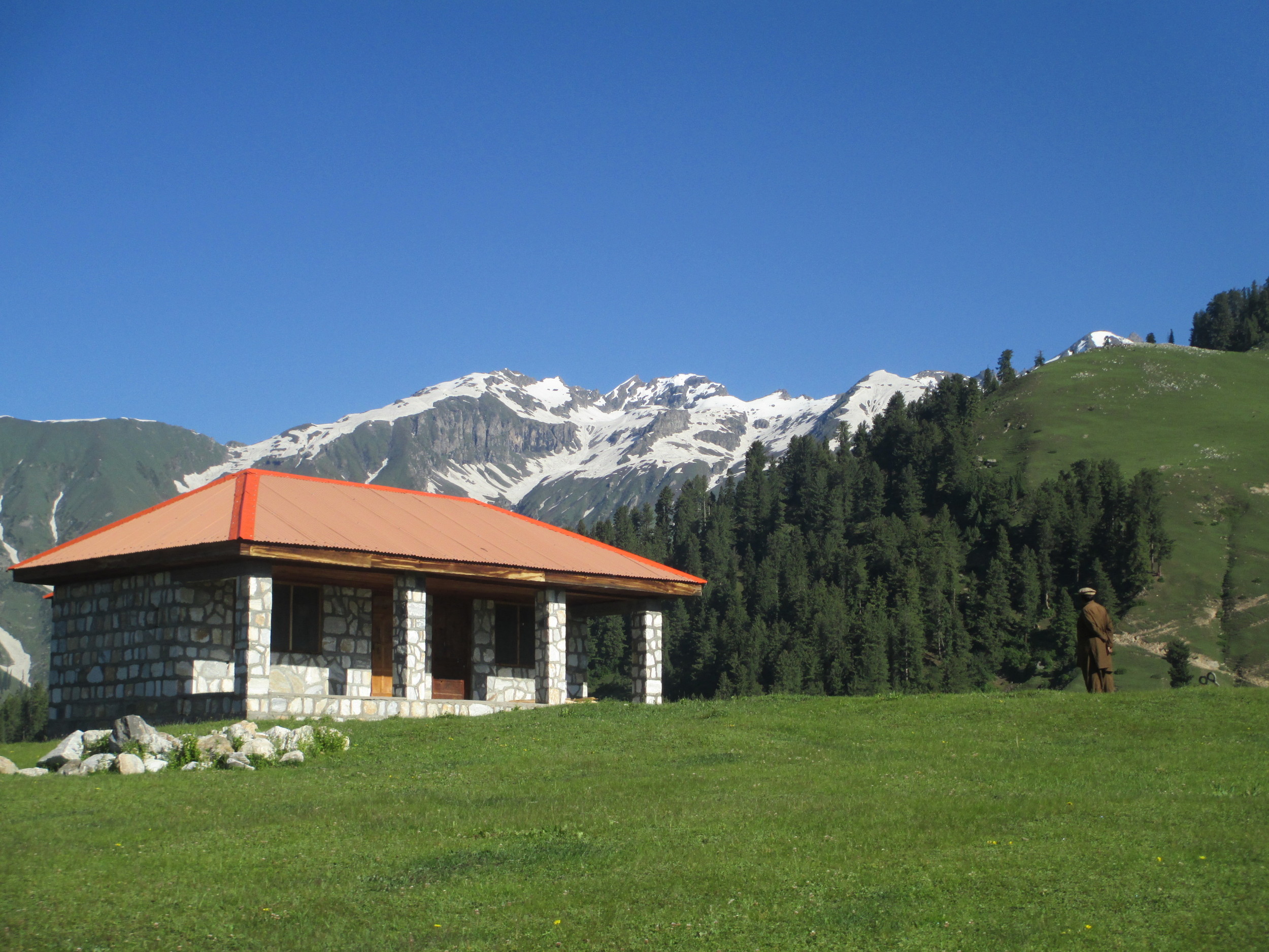 The lovely Alpine valley of Kaghan , here at Janids mountain hut 2900 m on Dana Meadows, Shingo Ri at about 4600 m dominates the skyline