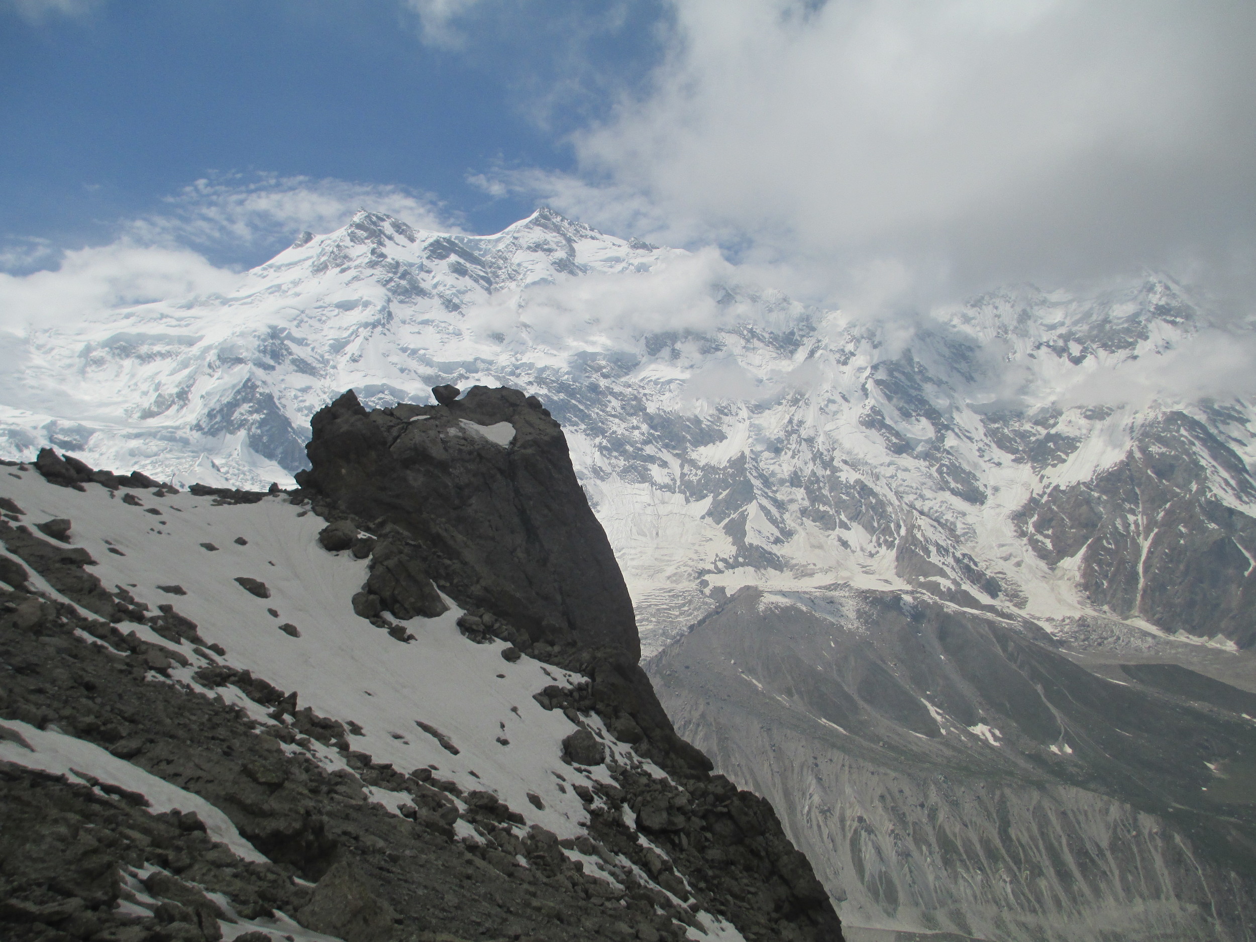    
 
 
      It was the most imposing view I have ever had, when after the descent through fog and moisture we rounded a corner and suddenly the gigantic amphitheatre of the Nanga with her satellites to the east, towering above the Rakhiot glacier 