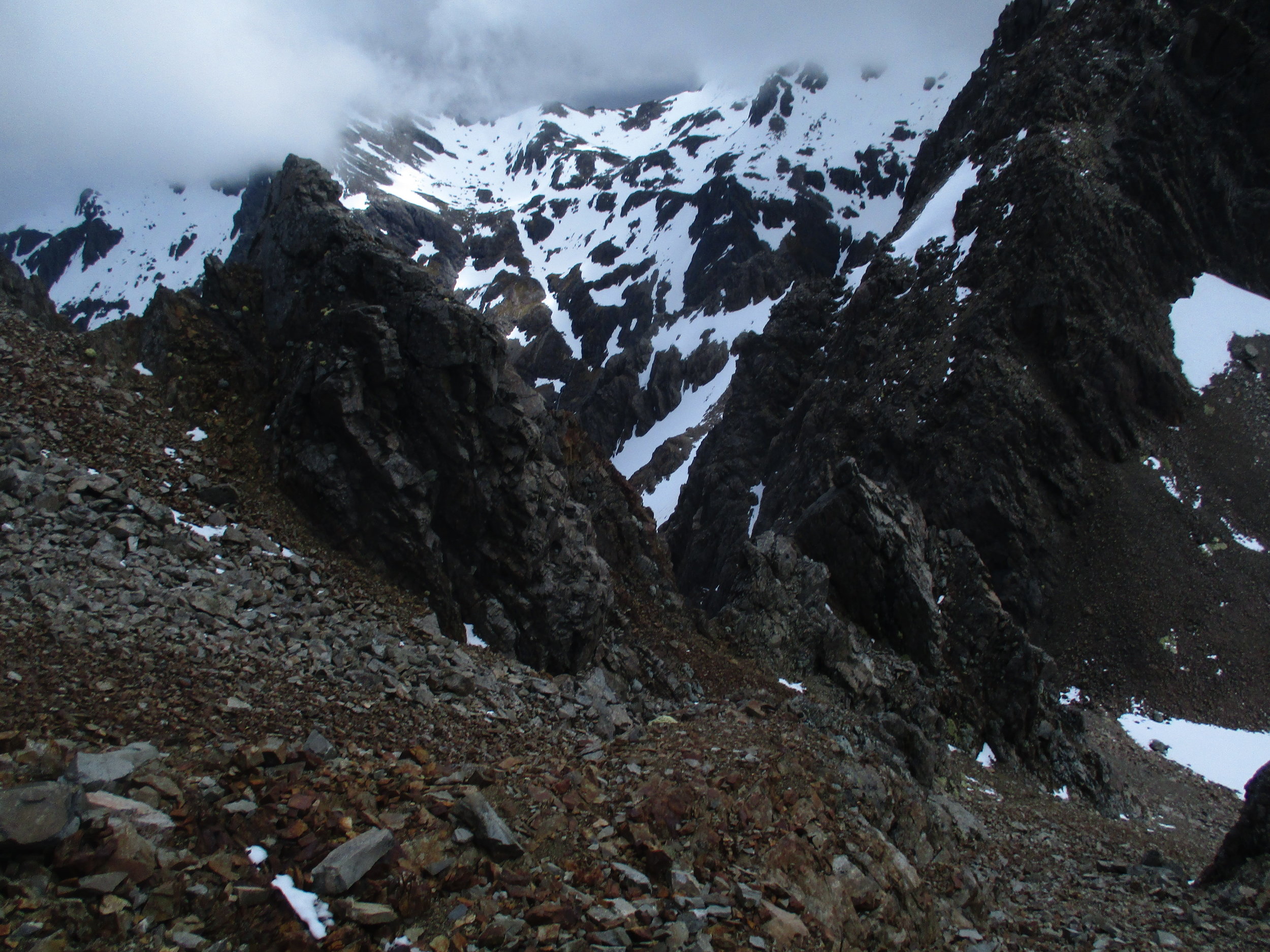 Steep loose rock and scree was order of day on Angelus ridge. Mount Hopeless behind.