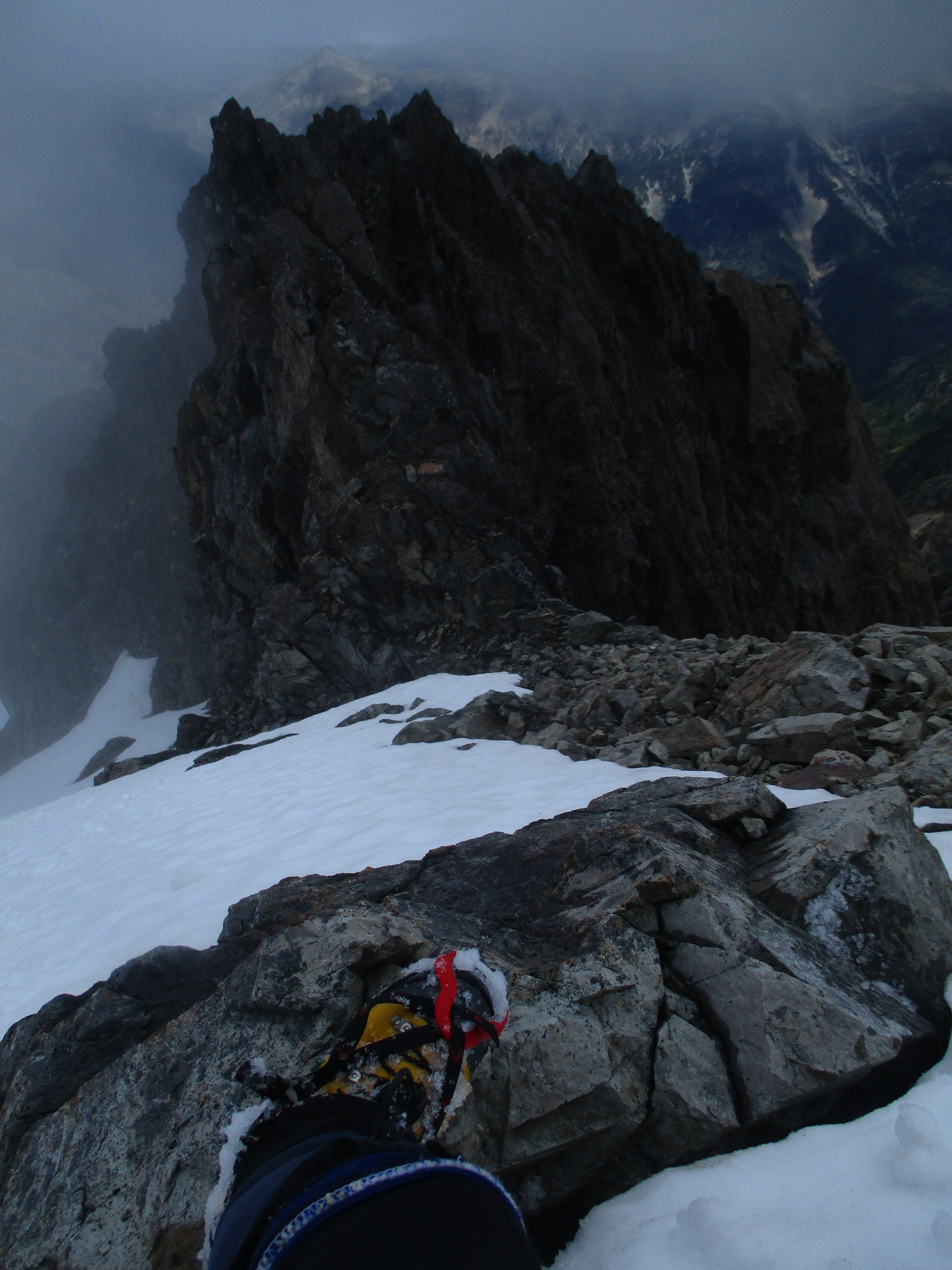 Oh oh, the wrong way up!! looking down increasingly steep slopes, Siberia valley on the right was the misnamed one this day as my route below was the one in clag and snow showers..