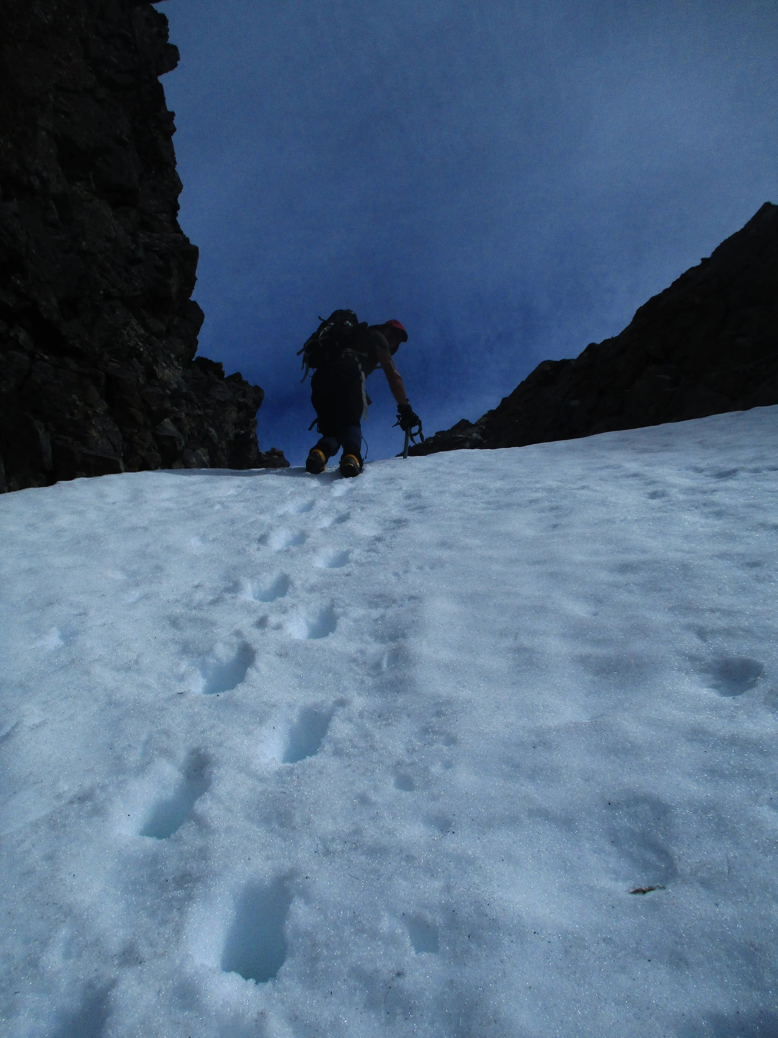 stepping up the final slope to the col.