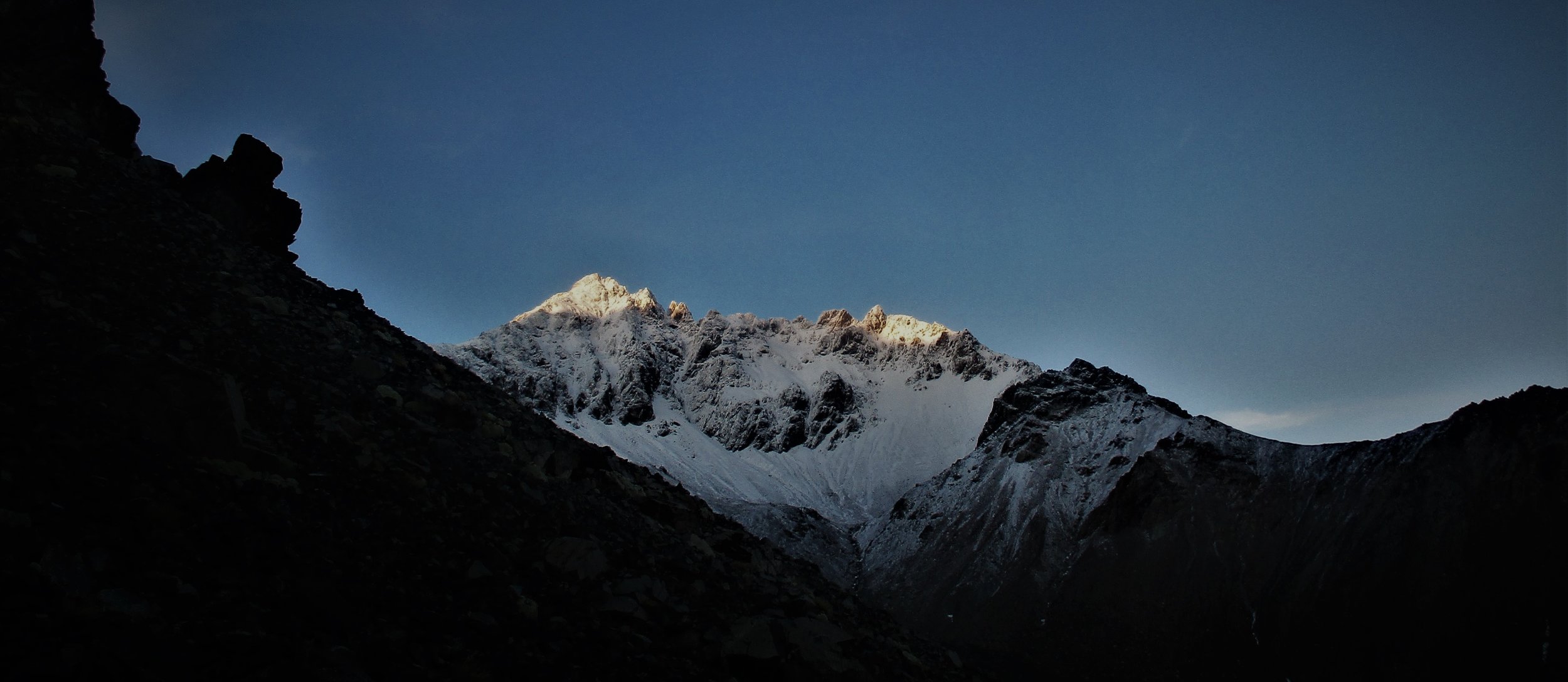 Mount Alarm is defined by early winter ice at dawn during the ascent of Mt Tapuae-o-Uenuku
