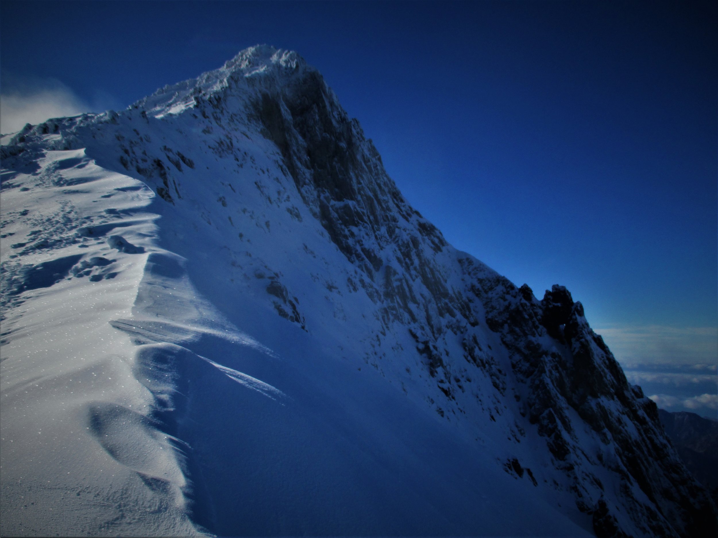 The final ridge and South face come into view after several hours climb.