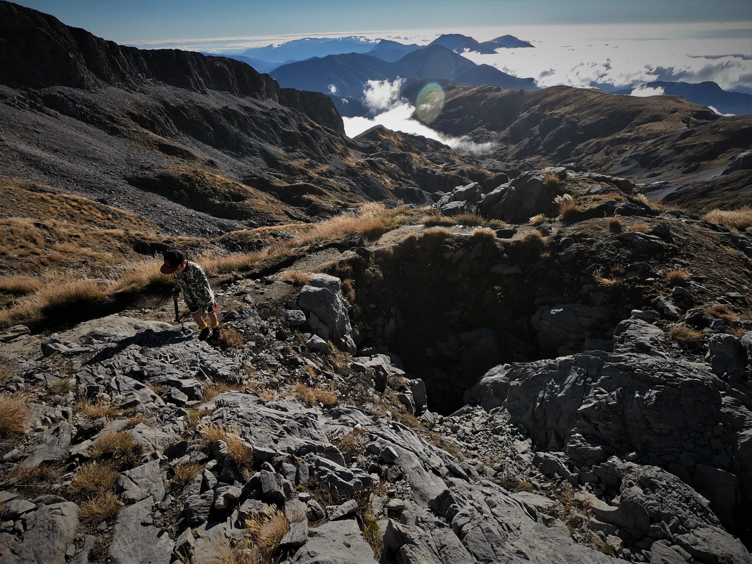 Leo , discovering the incredible karst country of weather worn limestone en route to the summit.