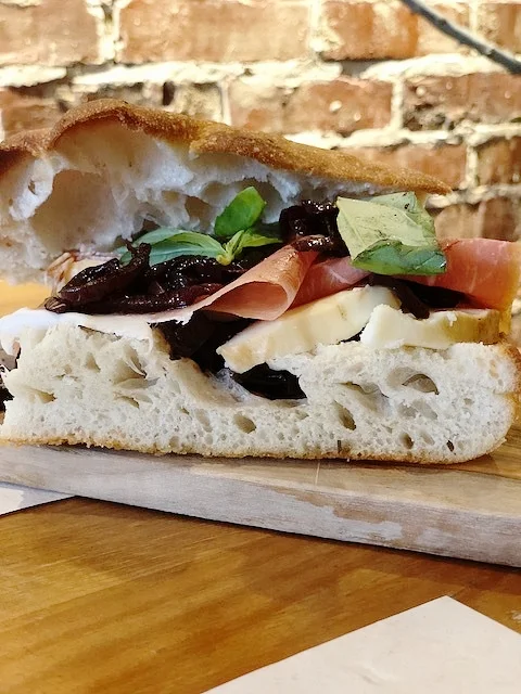 Prosciutto, caramelised onion, and smoked cheese focaccia