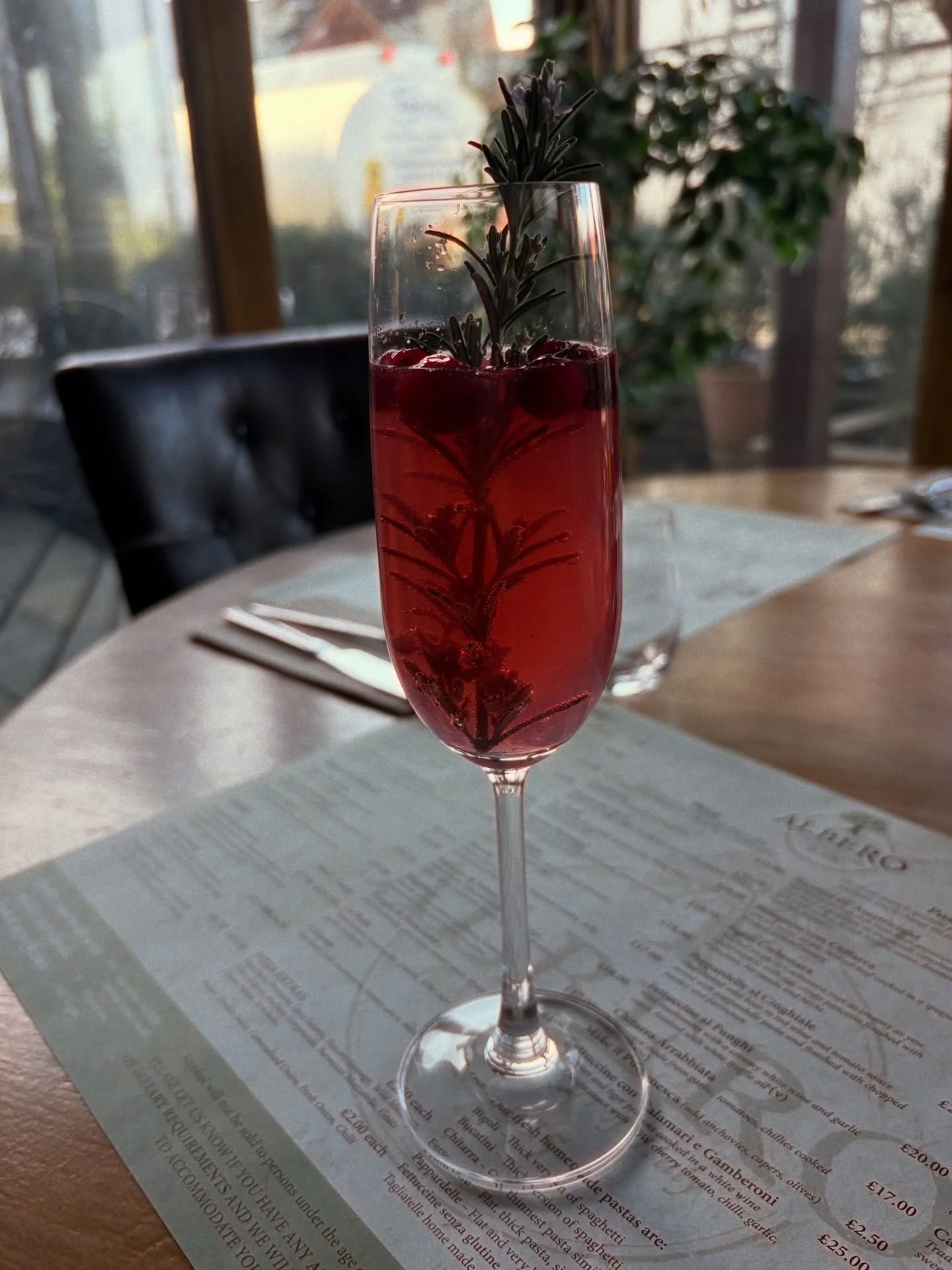 Simple, classy and so festive 🥂 

Poinsettia-&gt; cointreau, cranberry, prosecco with rosemary and frozen berries 

#coctail #festivemenu #festiveseason #alberobrockenhurst #italianrestaurant #newforest #brockenhurst