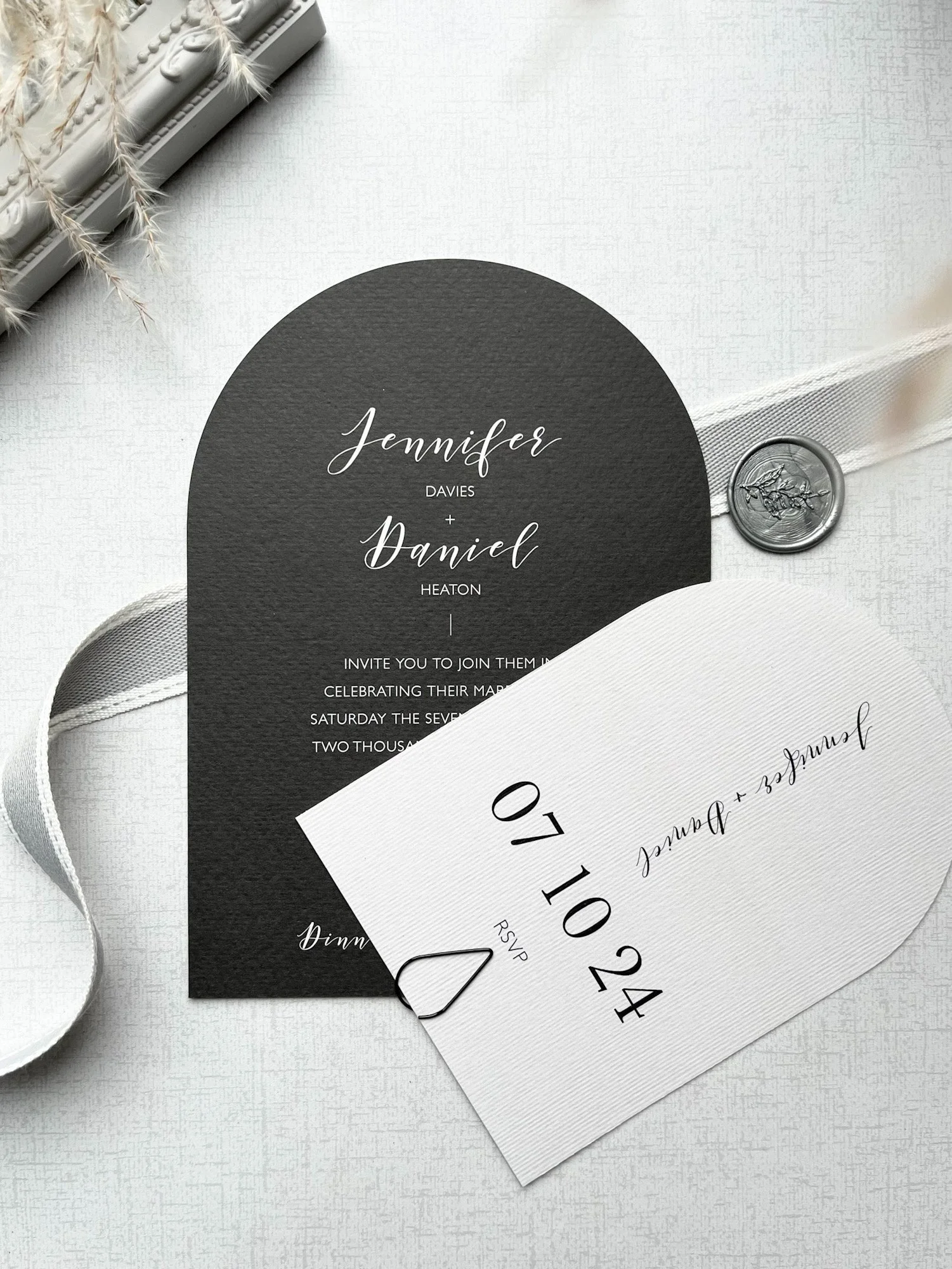 Arched wedding invitation and RSVP open
