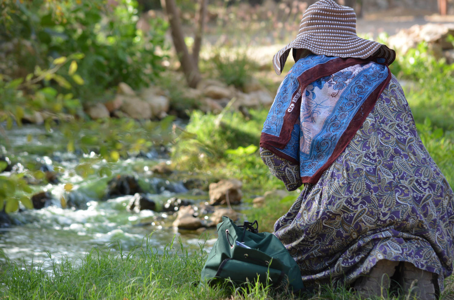 Setting up her tripod to shoot the stream.