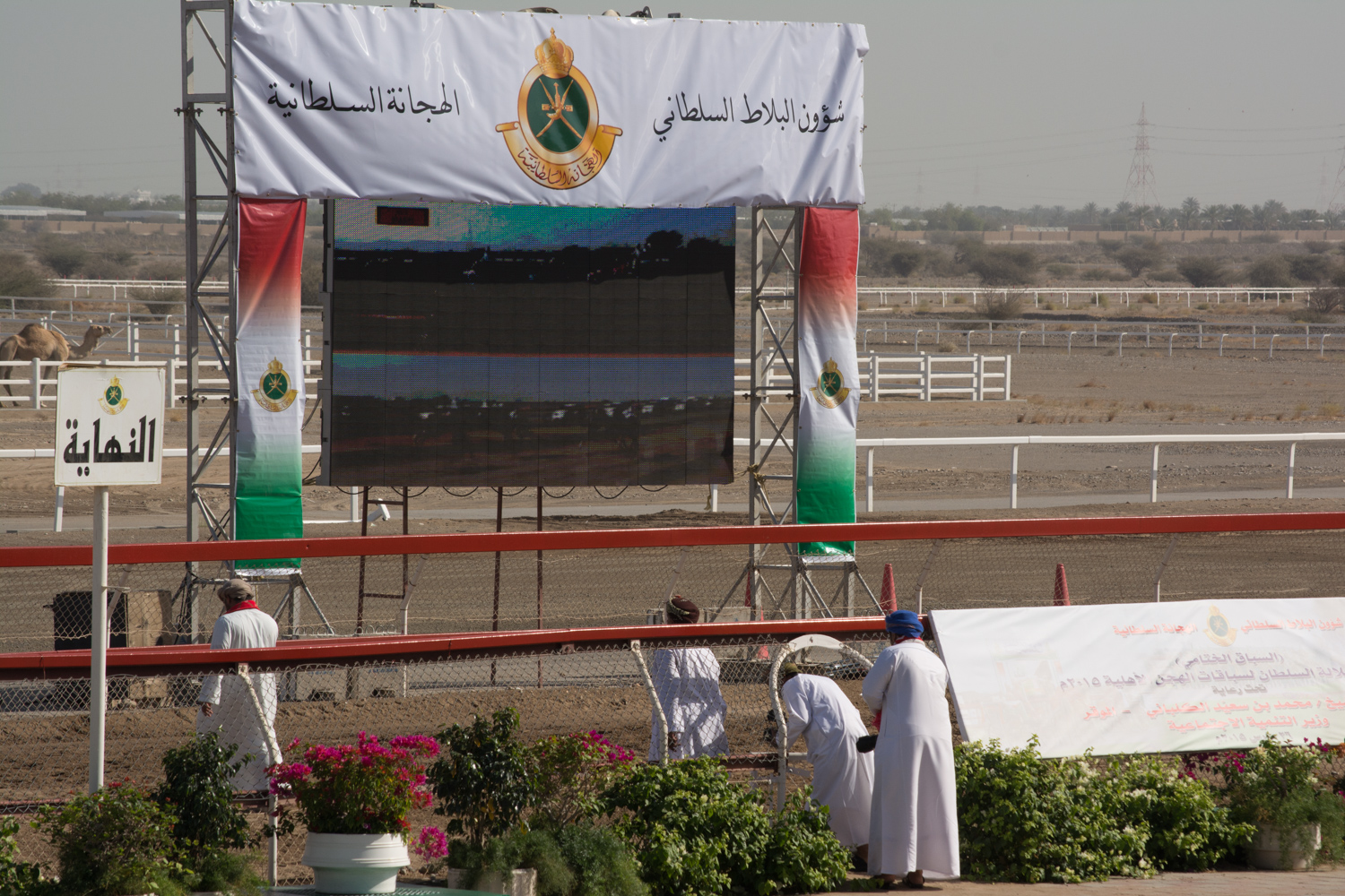 The official photographers crossing the track.