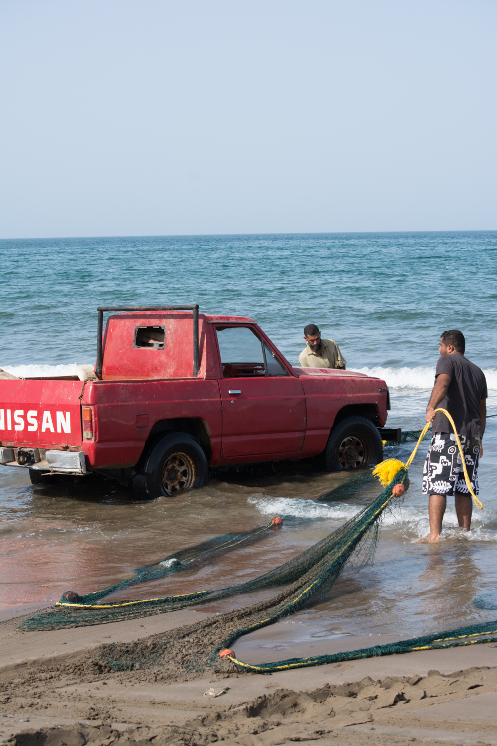 One pull at a time the net and catch crawl toward the fishermen.
