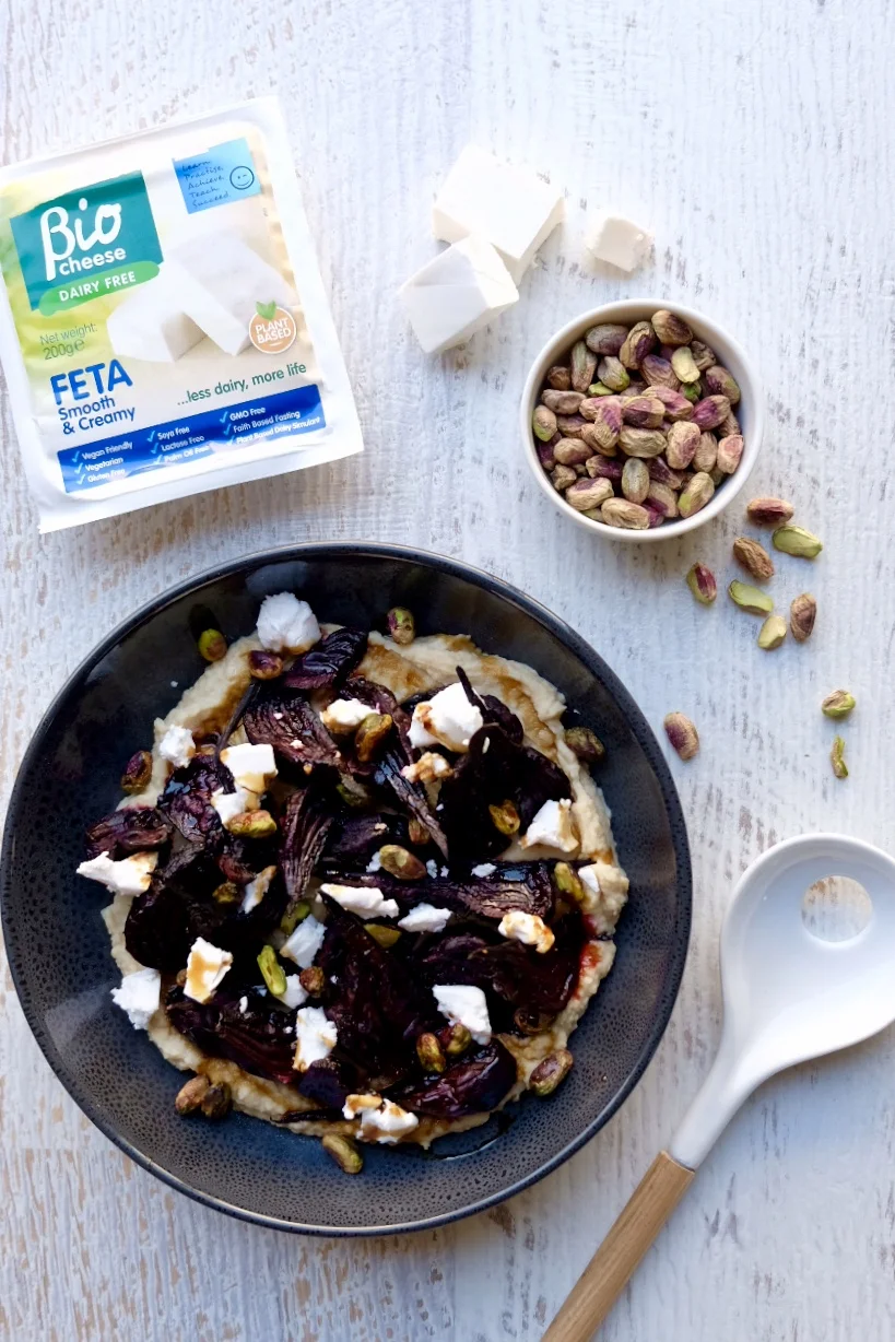 White Bean Puree Topped with Crumbly Bio Cheese Feta and Roasted Beetroot Hearts