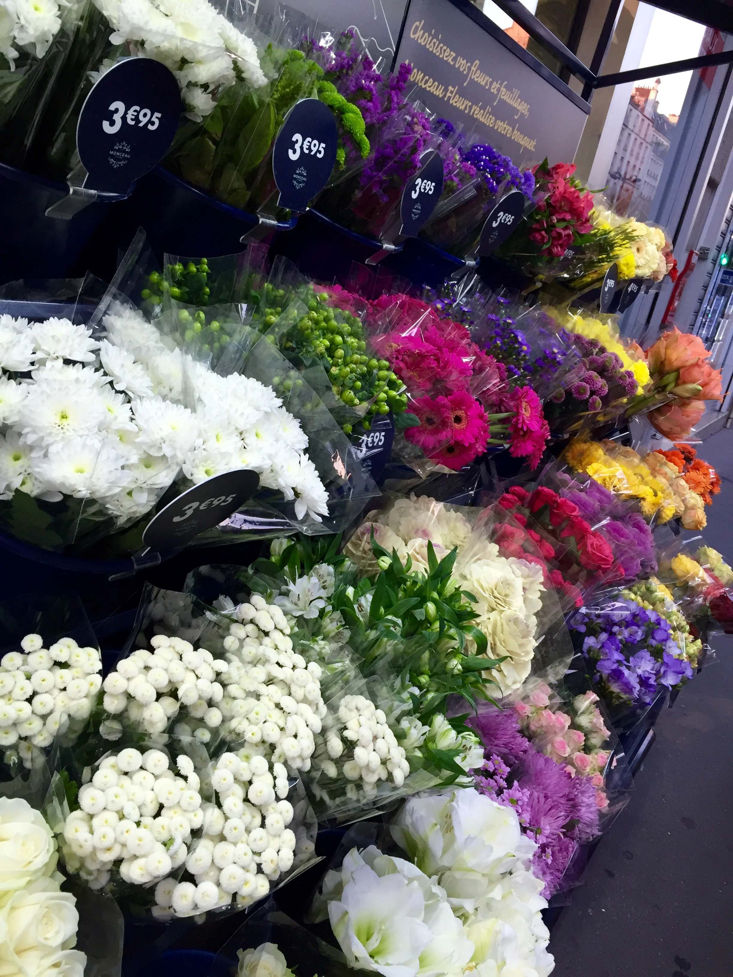 Flower store along the sidewalk, couldn't resist stopping to smell the roses!