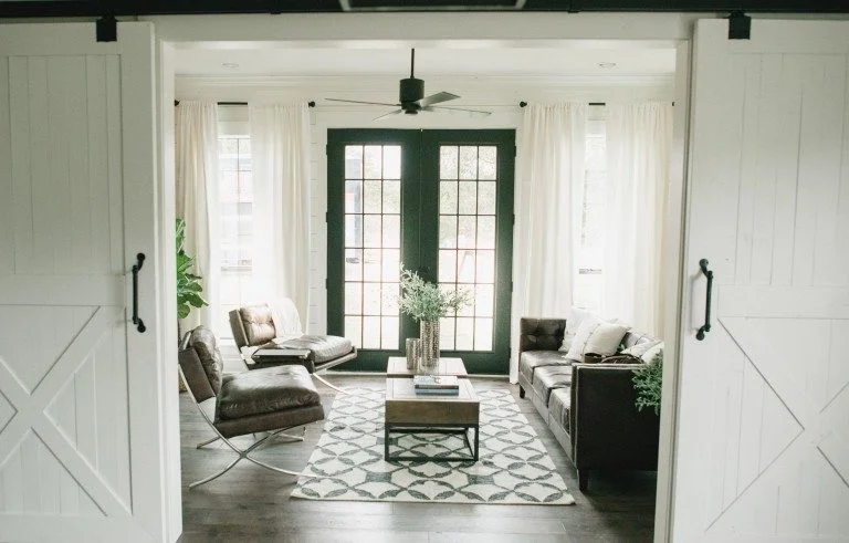 Sliding barn doors are another feature used quite frequently to complete that farmhouse look. This specific space was actually a horse barn converted into a family home.