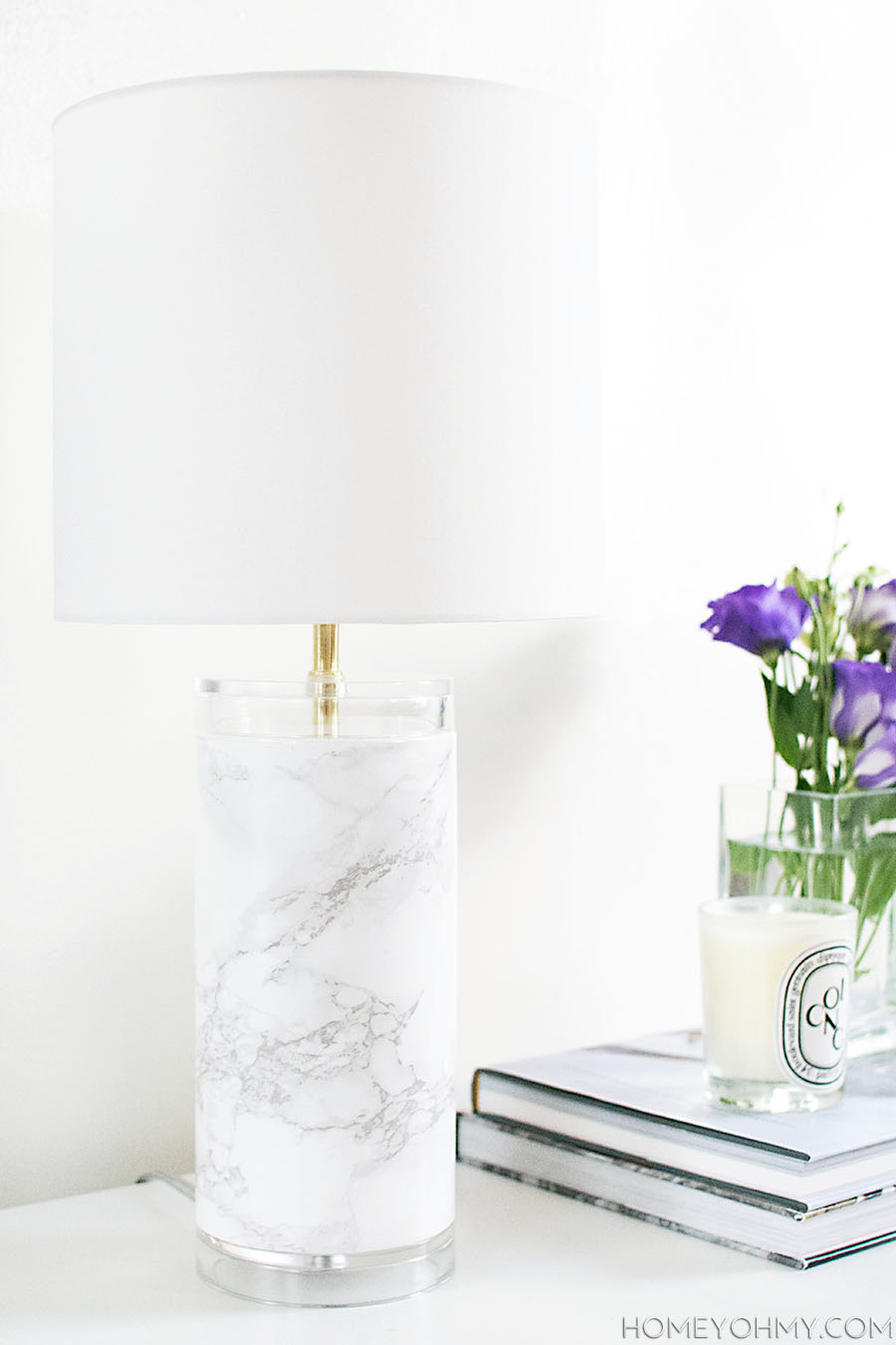 This DIY Marble Table Lamp is a cheap and efficient way to turn a boring table lamp into something beautiful and exotic. Marble accessories like this look good in any room with a multitude of design styles. Get your craft on with this simple update for a style upgrade!