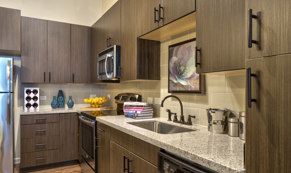 (Not our actual apartment, but similar layout! Ours has grey cabinets and darker granite. More photos to come as unpacking continues)